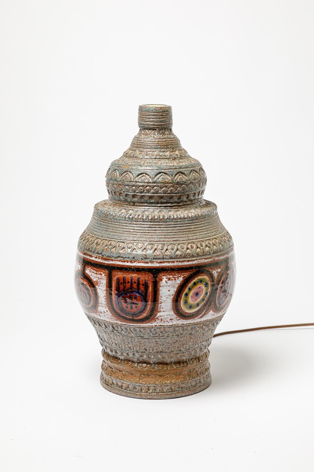 Blue and red glazed stoneware table lamp by Jacques Poussine. 
Artist signature on the side. Circa 1970.
H : 17.1 x 8.7 inches (ceramic only).
Sold with a European electrical system.