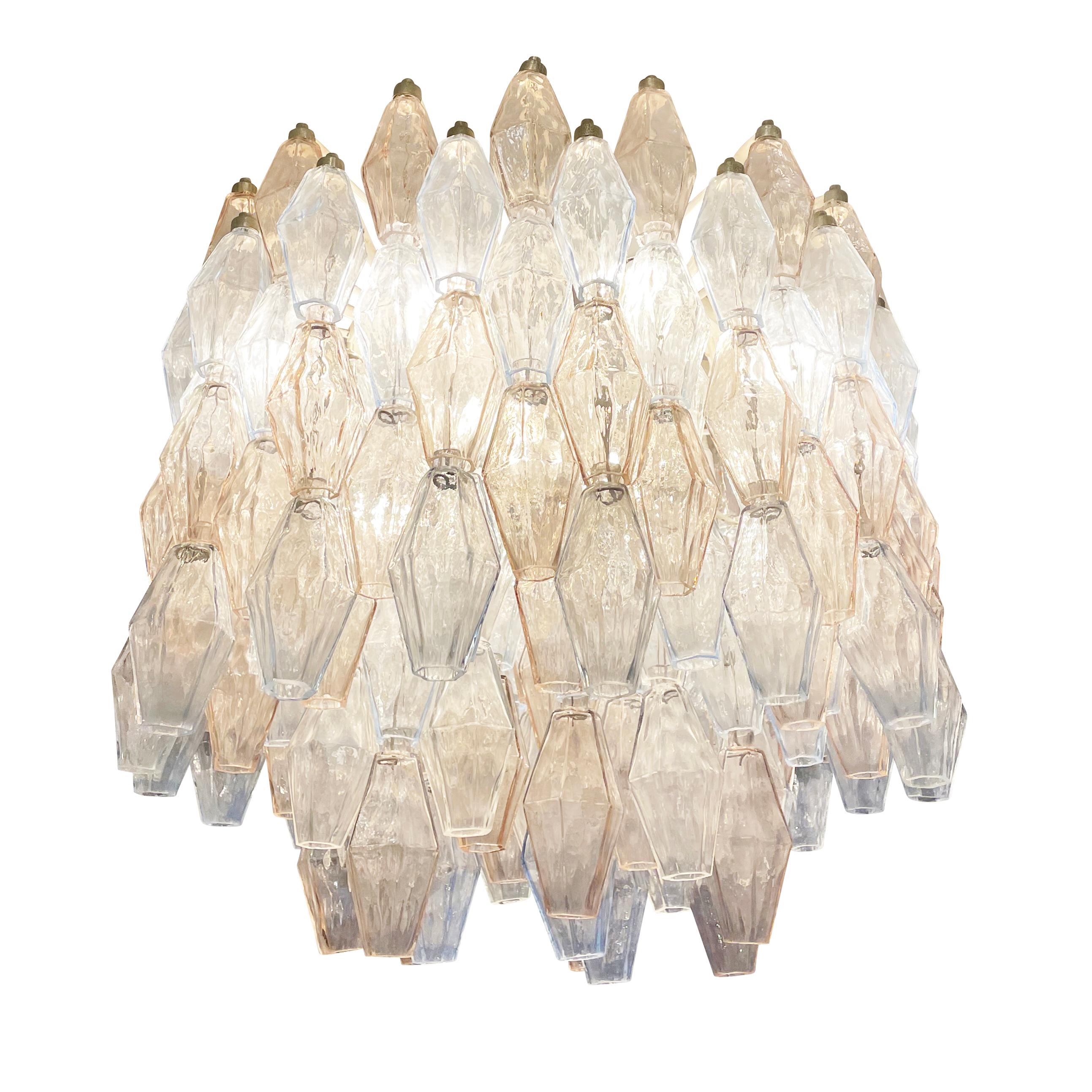 Midcentury chandelier by Venini made with their iconic poliedri Murano glasses. The glasses are a mix of light blue ones and light rose’ ones mounted on a white lacquered frame. Ready to hang on a chain.

Condition: Excellent vintage condition,