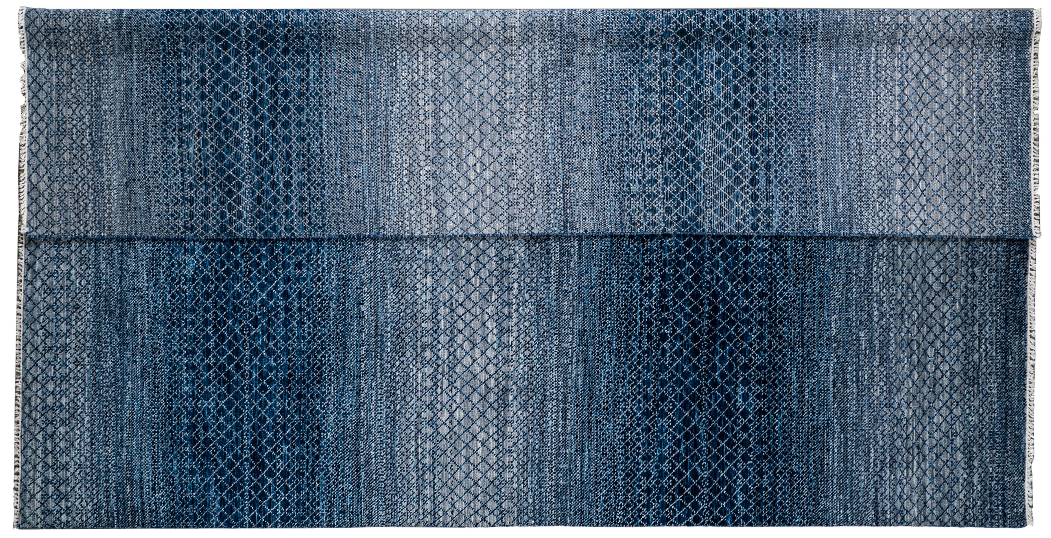 Alternating colors of blue and silver with diamond and wave patterns create a serene yet fun rug that is sure to make any space pop. This modern/contemporary rug is made from all wool fibers that is not only durable and fun to look at but is also