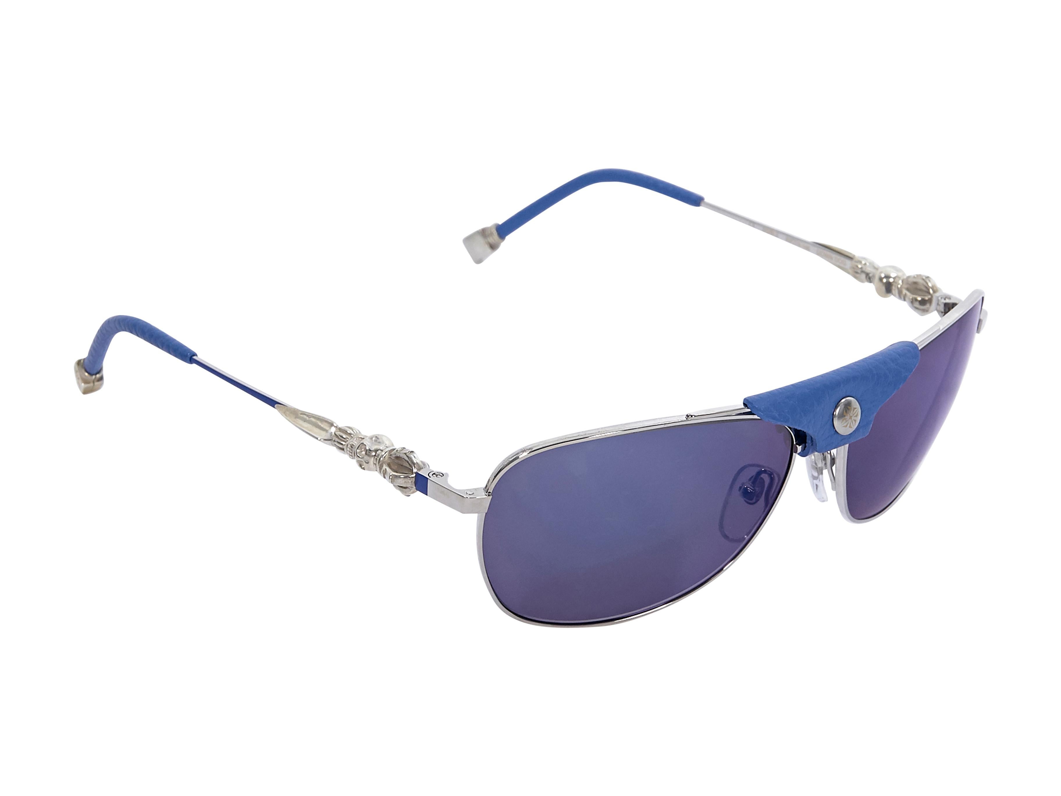 Product details:  Blue leather-trimmed and silver aviator sunglasses by Shamballa.  Gold and silver-tone hardware. Case included. Style with a cream leather shift dress. 5.75