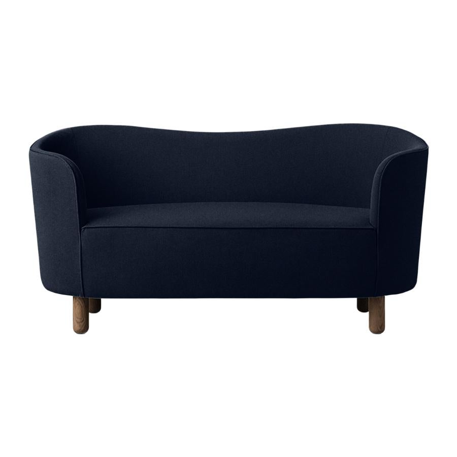 Blue and smoked oak raf simons vidar 3 mingle sofa by Lassen.
Dimensions: W 154 x D 68 x H 74 cm.
Materials: textile, oak.

The Mingle sofa was designed in 1935 by architect Flemming Lassen (1902-1984) and was presented at The Copenhagen