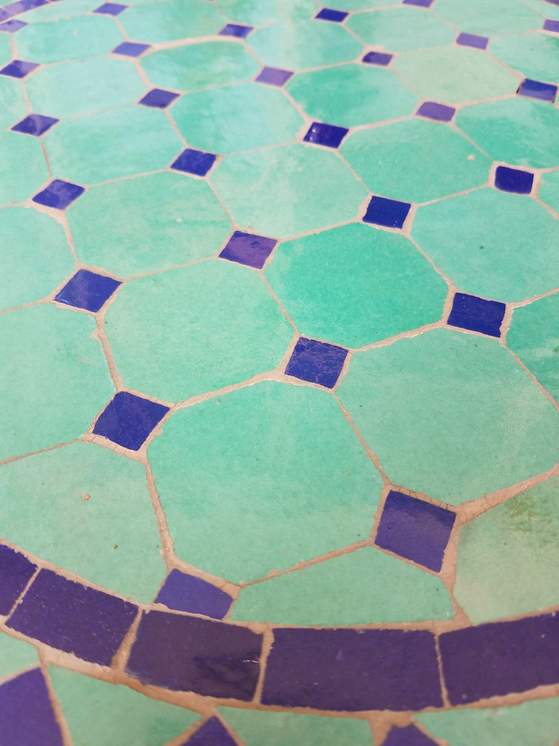 100 % glazed. Round shape. Blue and turquoise Moroccan mosaic table measuring approximately 20