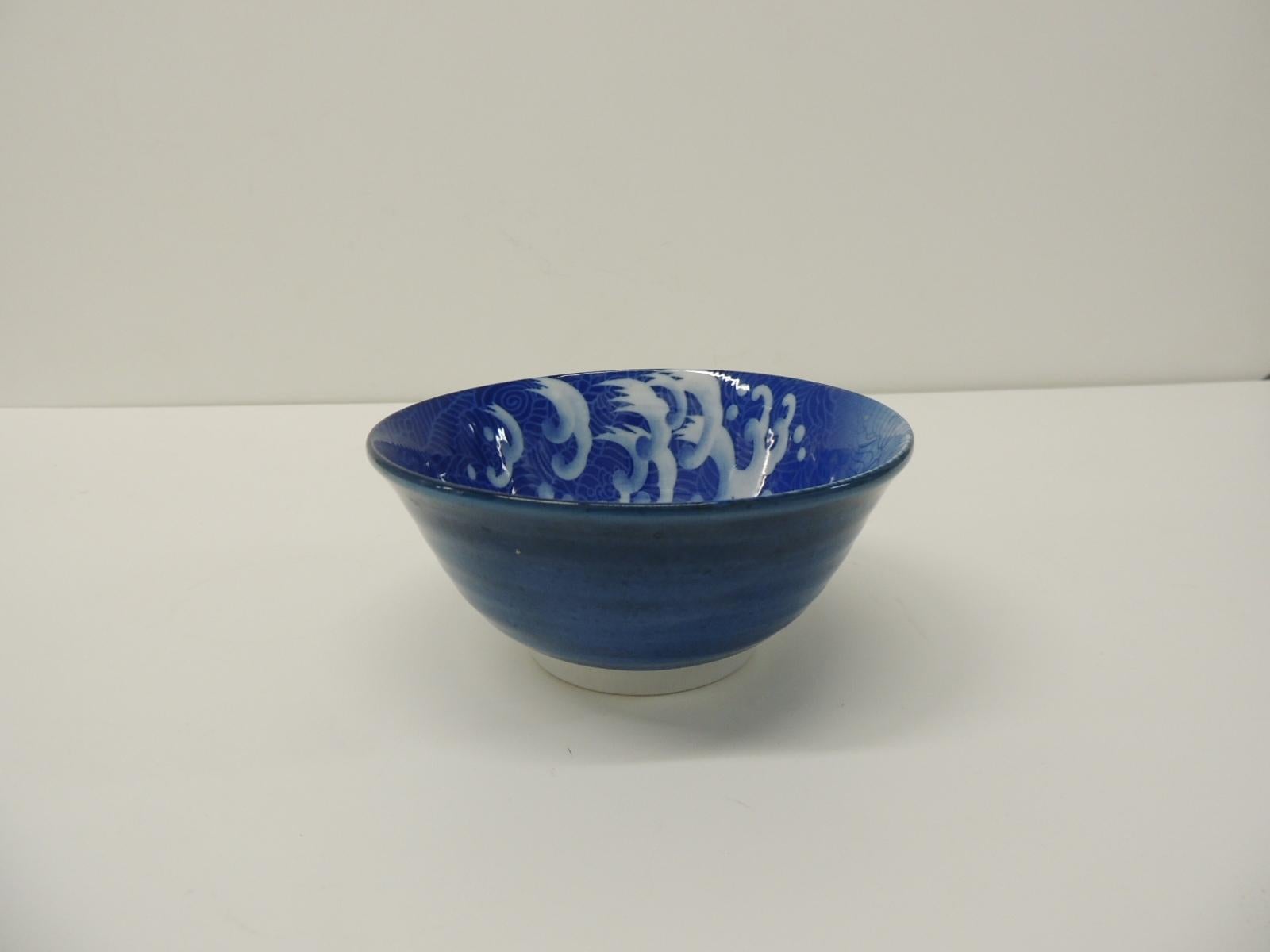 Blue and white Asian round small decorative bowl.
Depicting birds and skies.
Size: 6