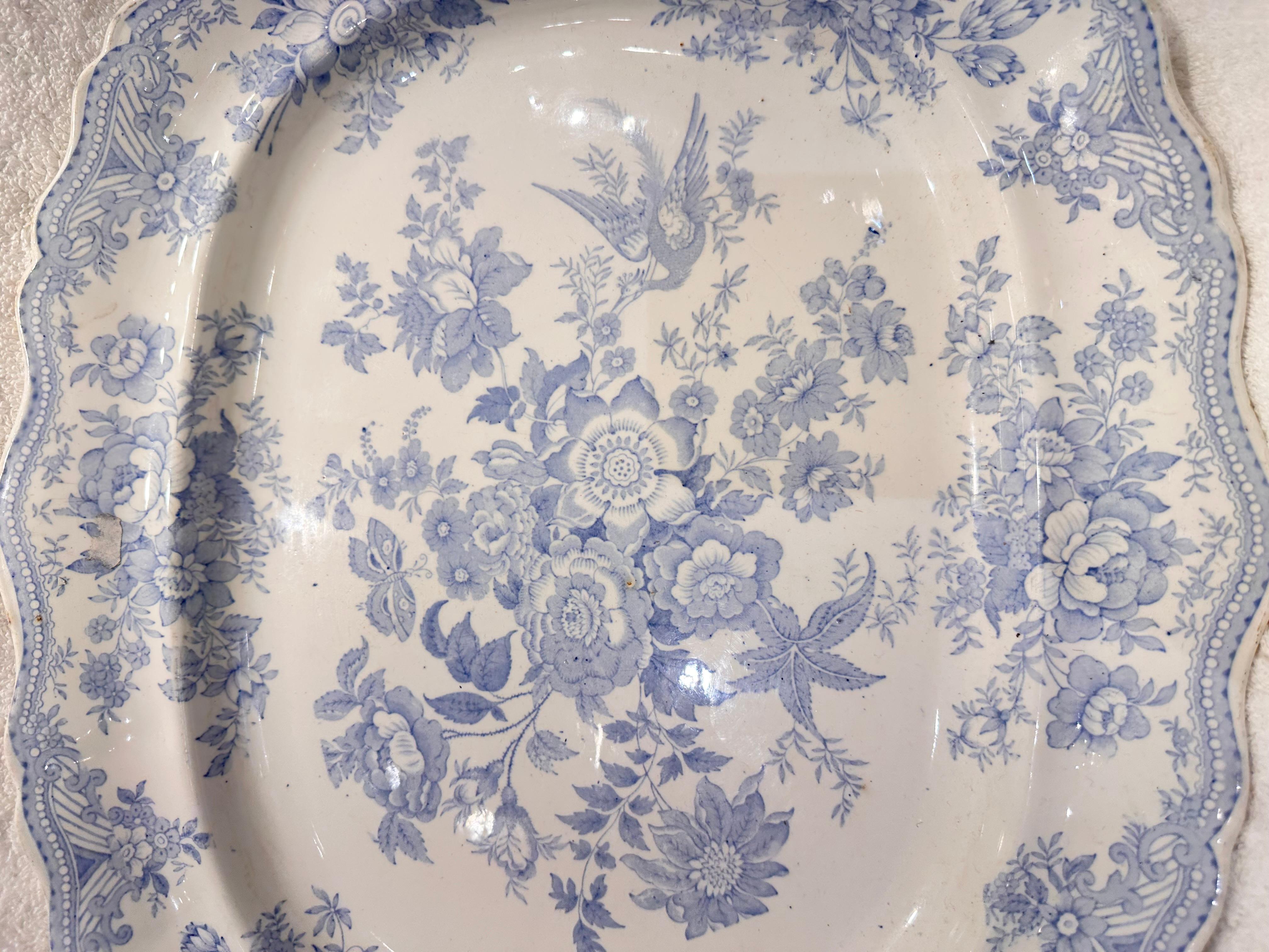 This very soft blue and white platter is the perfect way to add some color to your space! Whether that be on a table top as a serving piece, or hanging on a wall display this platter will shine. This piece is in excellent condition with minimal