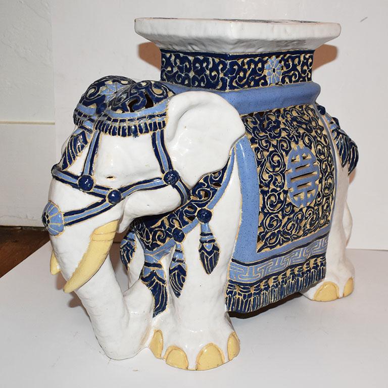 Beautiful blue and white ceramic elephant garden stool. This piece features an elephant shown with the trunk down. Would make a great garden stool, drink table in a living room, or as a plant stand.

Elephant Symbolism. Protection, good luck,