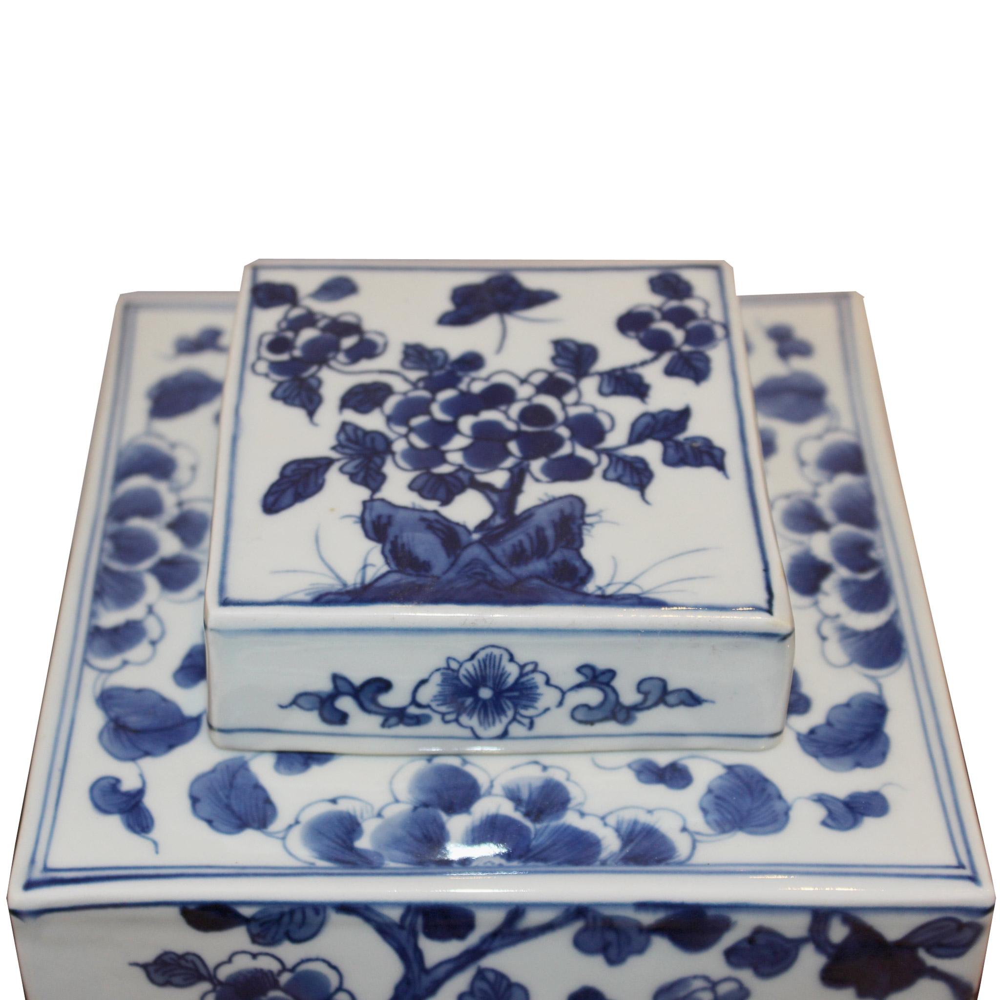 Blue and white ginger jar depicting flying birds around cherry blossom branches, symbolizing love and passion.  