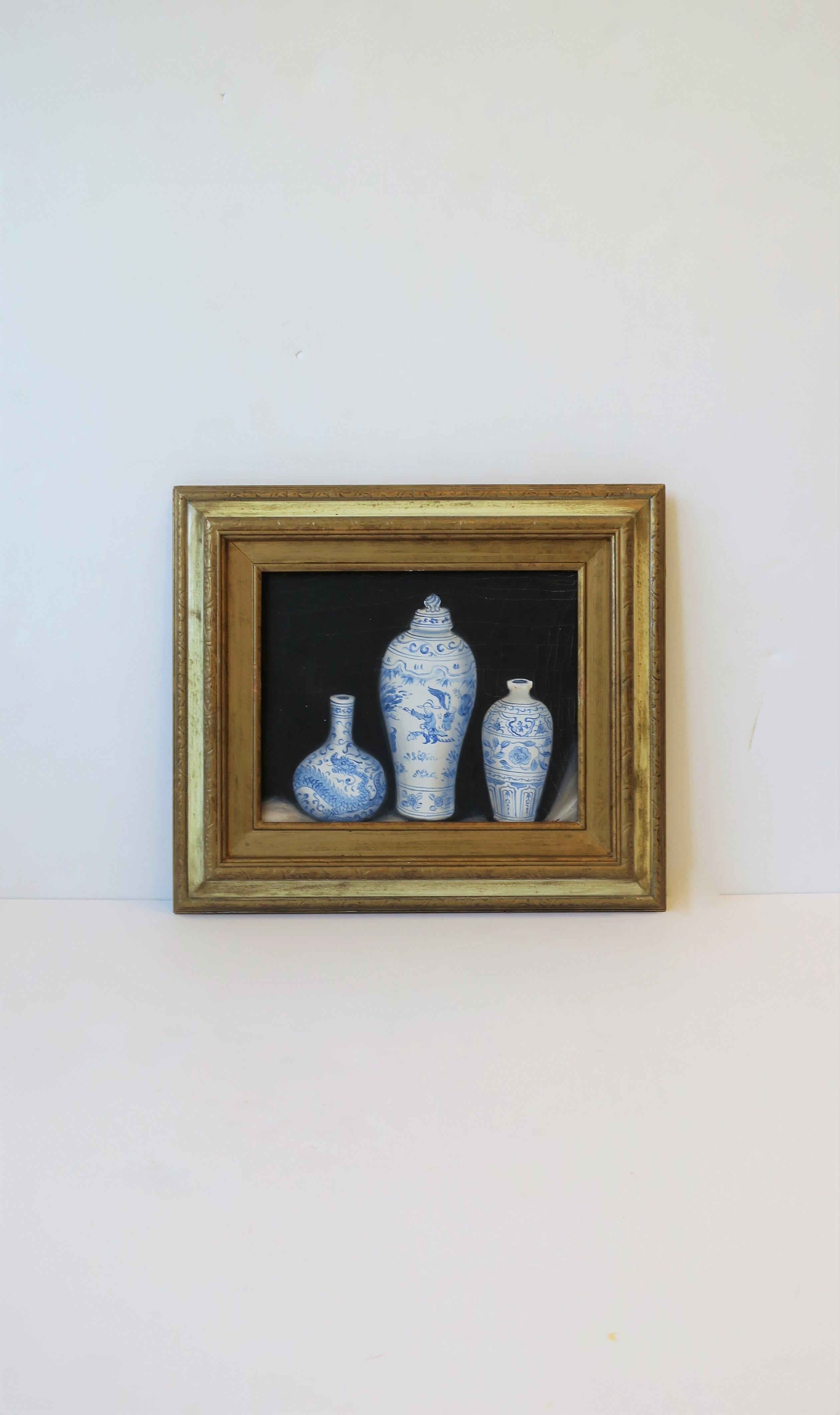 A beautiful signed oil or acrylic painting of three blue and white Chinese ceramic vase pottery pieces. The blue and white pottery pops with paintings black background. Painted vase on left-hand side depicts detailed dragon, closeup in image #8.
