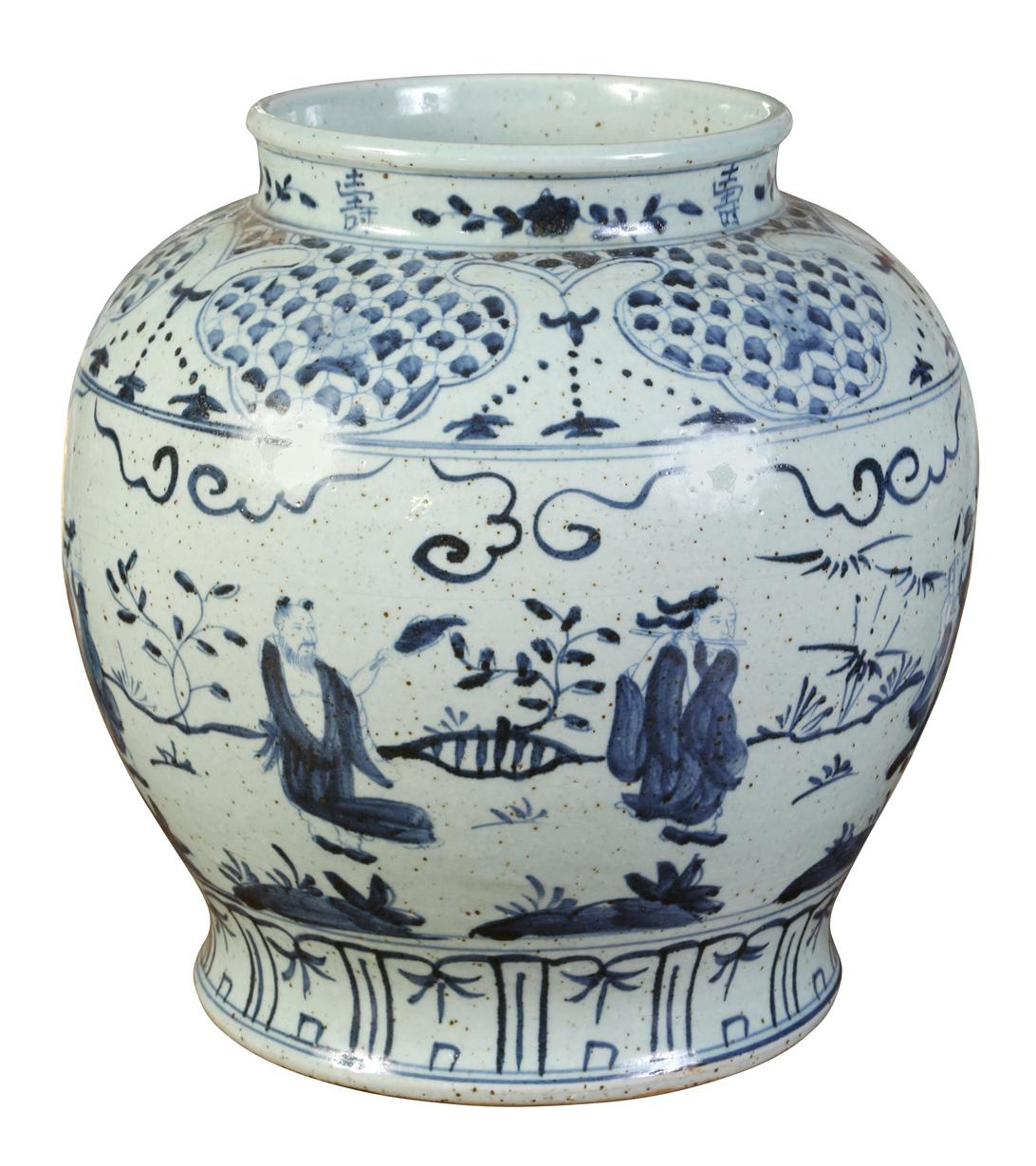 Blue and white will never go out a fashion. This large vase, decorated with figures and decorative accents, is perfect as a stand-alone decoration or as a vase.