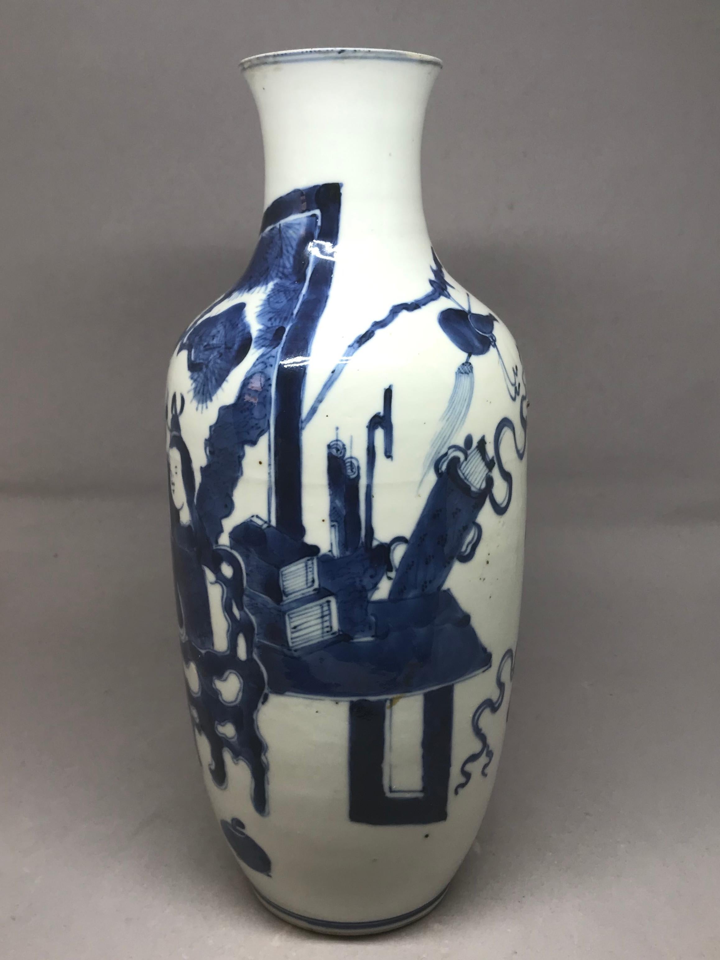 Blue and white Chinese vase. Qing era vase modeled in two sections of baluster form in white paste with strong blue figures and accoutrements, China, mid-19th century.
Dimensions: 11.38