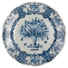 Blue and white chinoiserie dish with flower vase Delft 1740-1770 The Three Bells