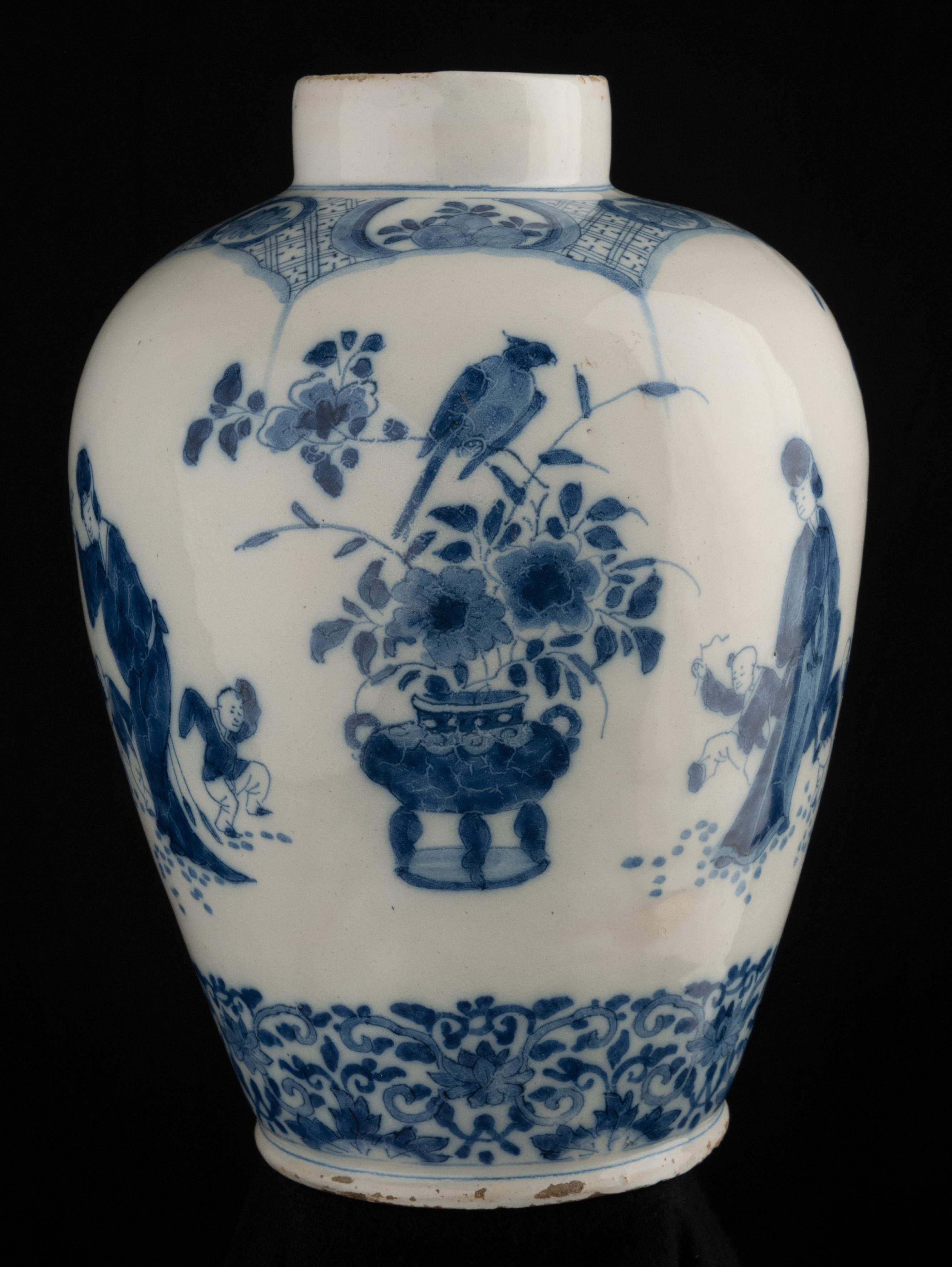 Blue and white chinoiserie jar
Delft, 1700-1720
The jar has a narrow straight neck and is painted in blue with a chinoiserie decor. Around the belly are three scenes of a Chinese woman with two dancing children. Interspersed are three different