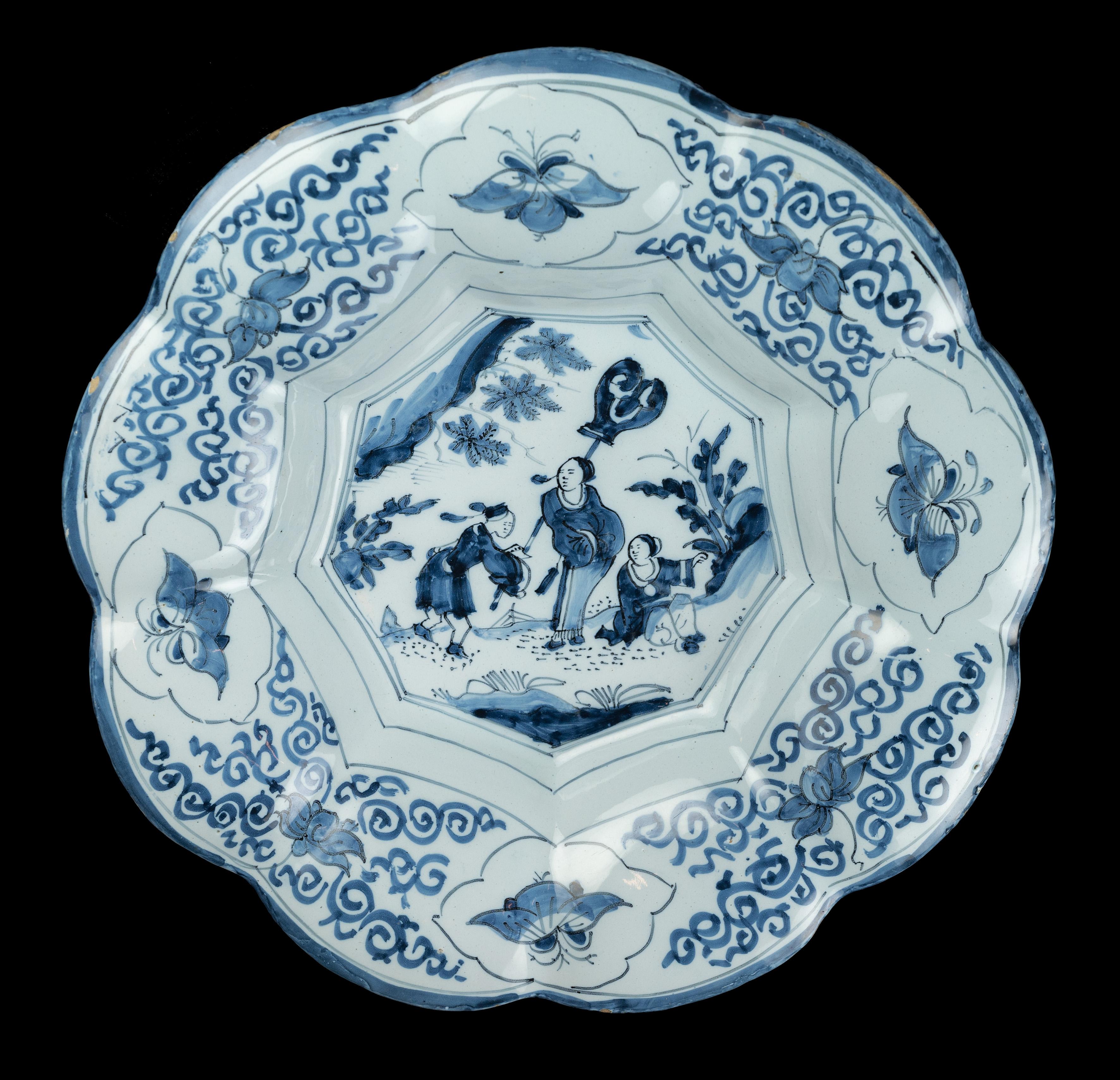 Blue and white chinoiserie lobed dish. Delft, 1680-1700 
Dimensions: diameter 35 cm / 13.77 in. 

The blue and white lobed dish is composed of nine wide lobes around a nine-fold centre and is painted with a chinoiserie decor, framed within lines