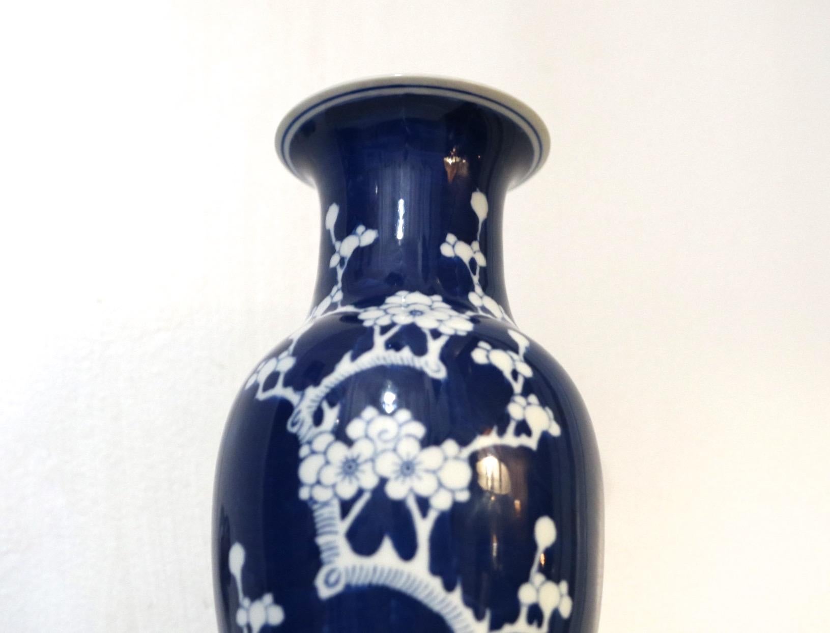 A vintage Chinese blue and white prunus decorated baluster vase is from the 
Zhongguo period (circa 1960-70) marks. Zhongguo translates to 