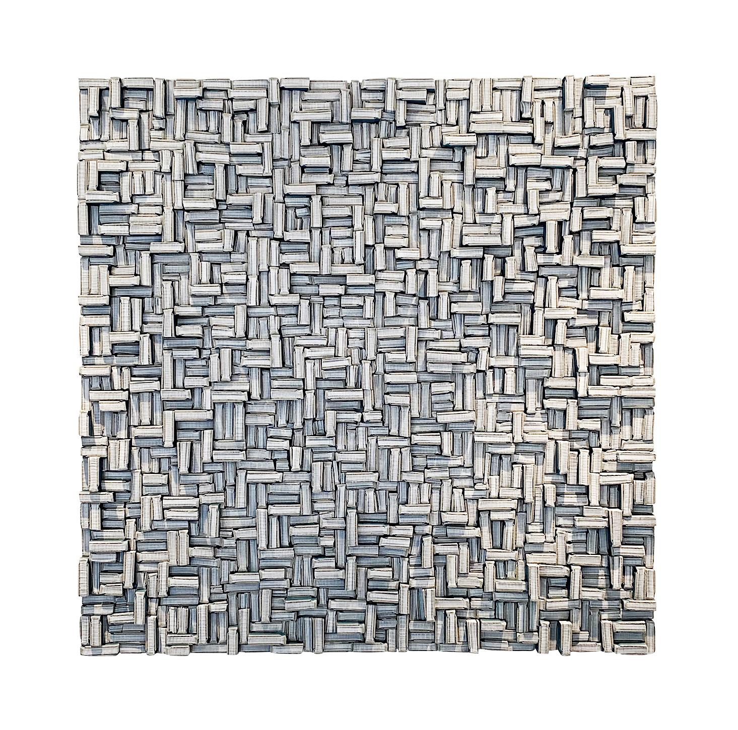 Der zeitgenössische Künstler Guy Leclef aus seiner Sammlung von Papierarbeiten.
Ausgeschnittene Stücke von kleinen, papiergebundenen Büchern mit blauem Einband.
Schneiden und Anordnen in verschiedenen Größen und Richtungen zur Schaffung von 
eine