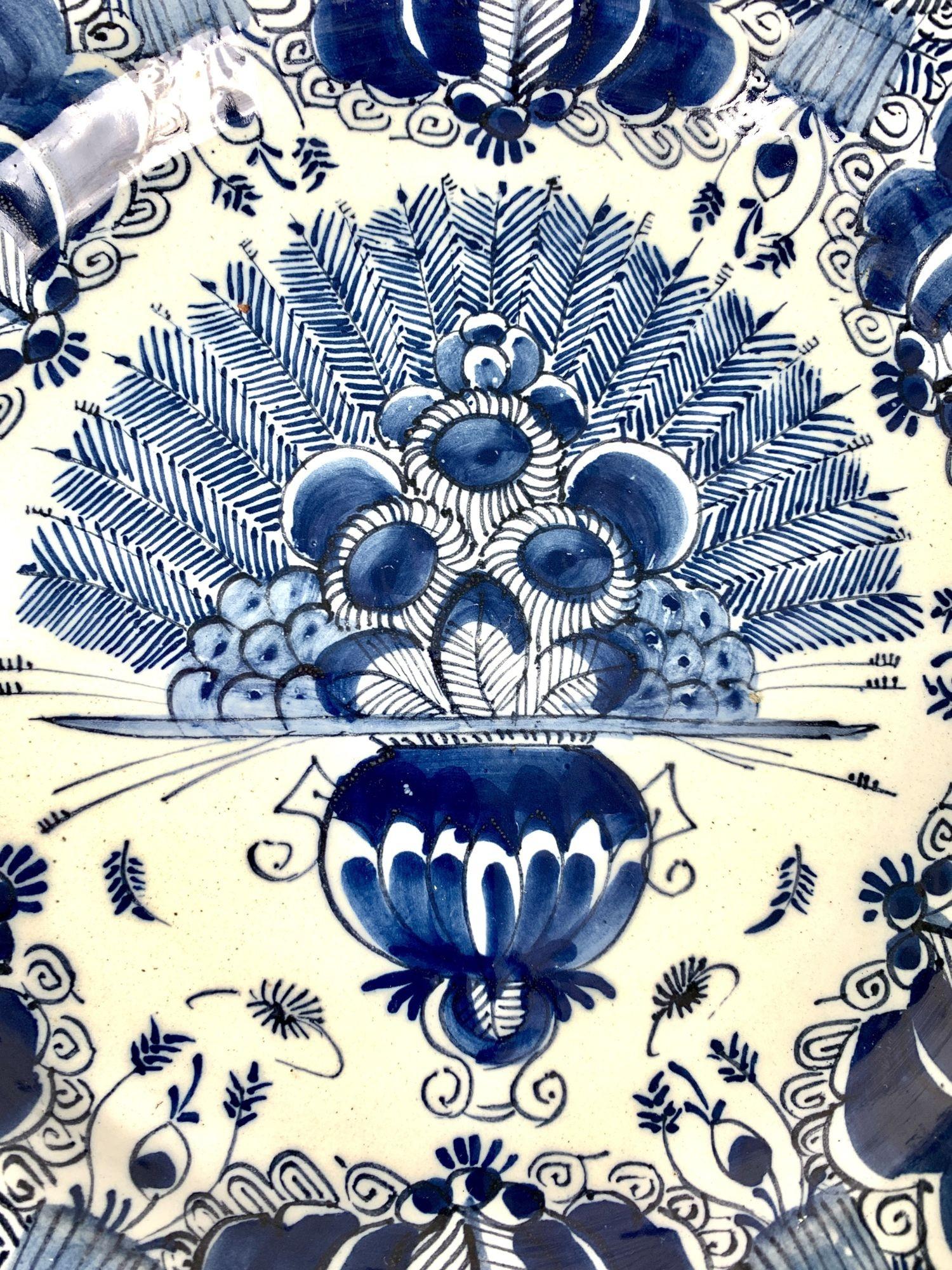 This beautiful blue and white Dutch Delft charger was hand-painted in deep cobalt blue 
in the factory of 