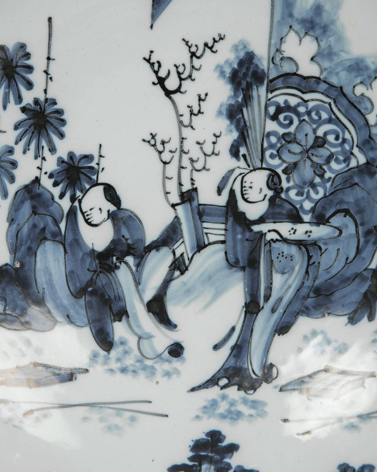We are pleased to offer this very special early to mid-17th century (1640-1650) blue and white Delft charger with a Chinese inspired theme. The Delft potter adopted a free and spontaneous style of painting, which recalls Chinese blue and white