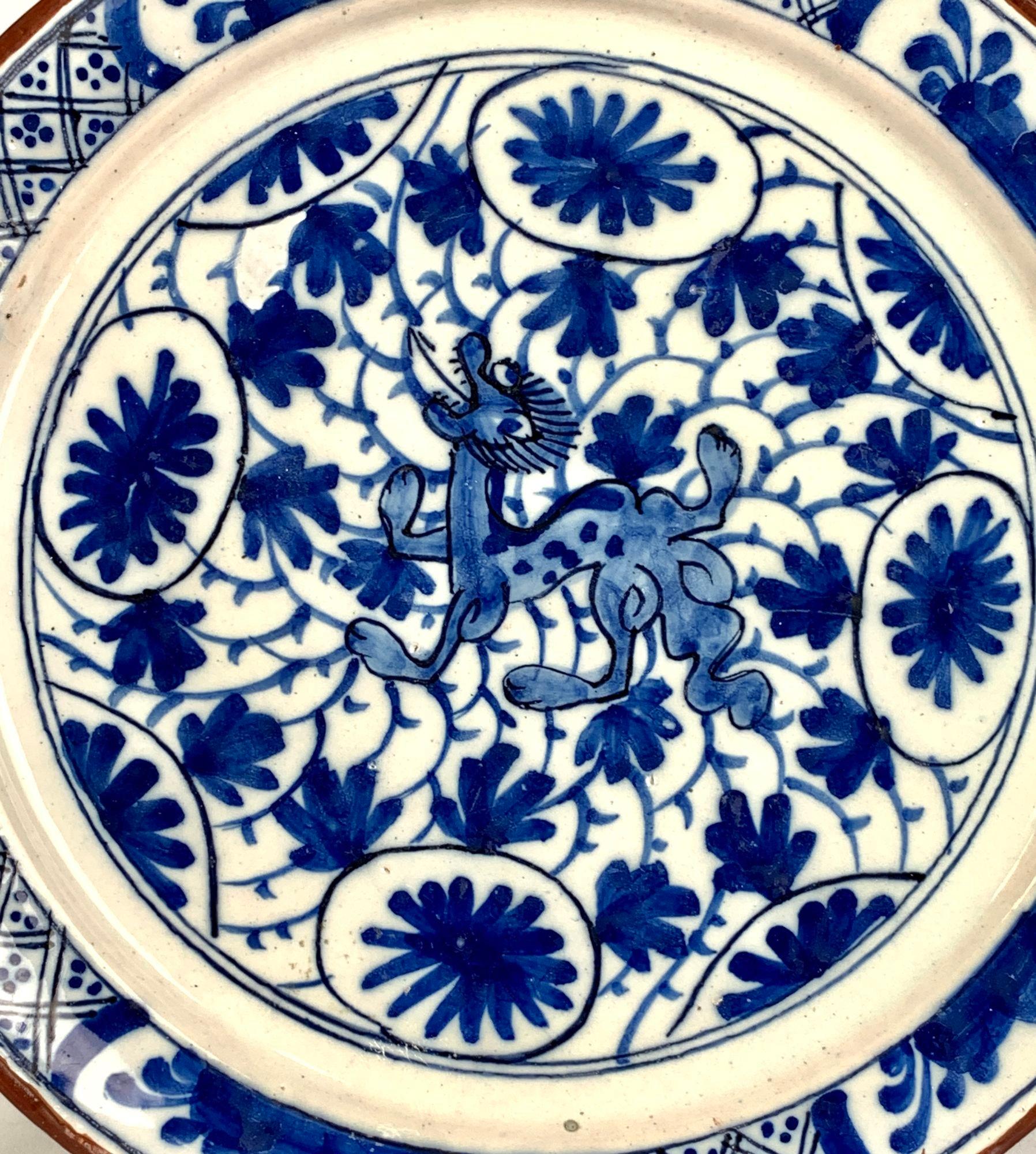 This exquisite dish is almost identical to a blue and white Delft dish in the Philadelphia Museum of Art Bequest collection of John W. Pepper. 1935-10-39.
The dish is described in detail by E B Scapp in her book 