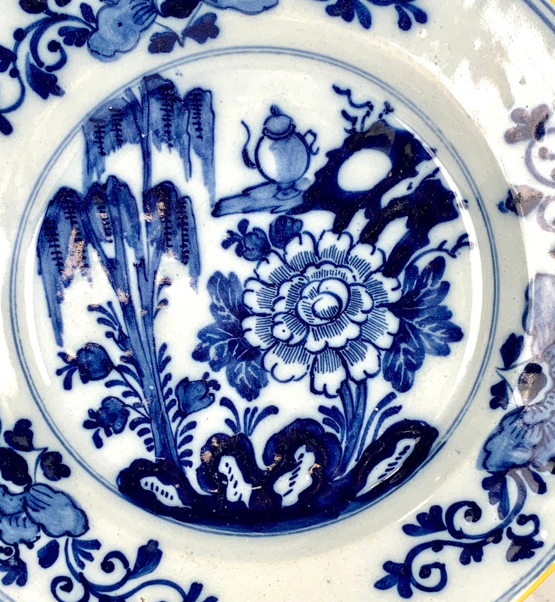 This blue and white Delft plate was hand painted circa 1800 in the Netherlands.
Provenance: On the reverse is the mark of De Porceleyene Claeuw, 