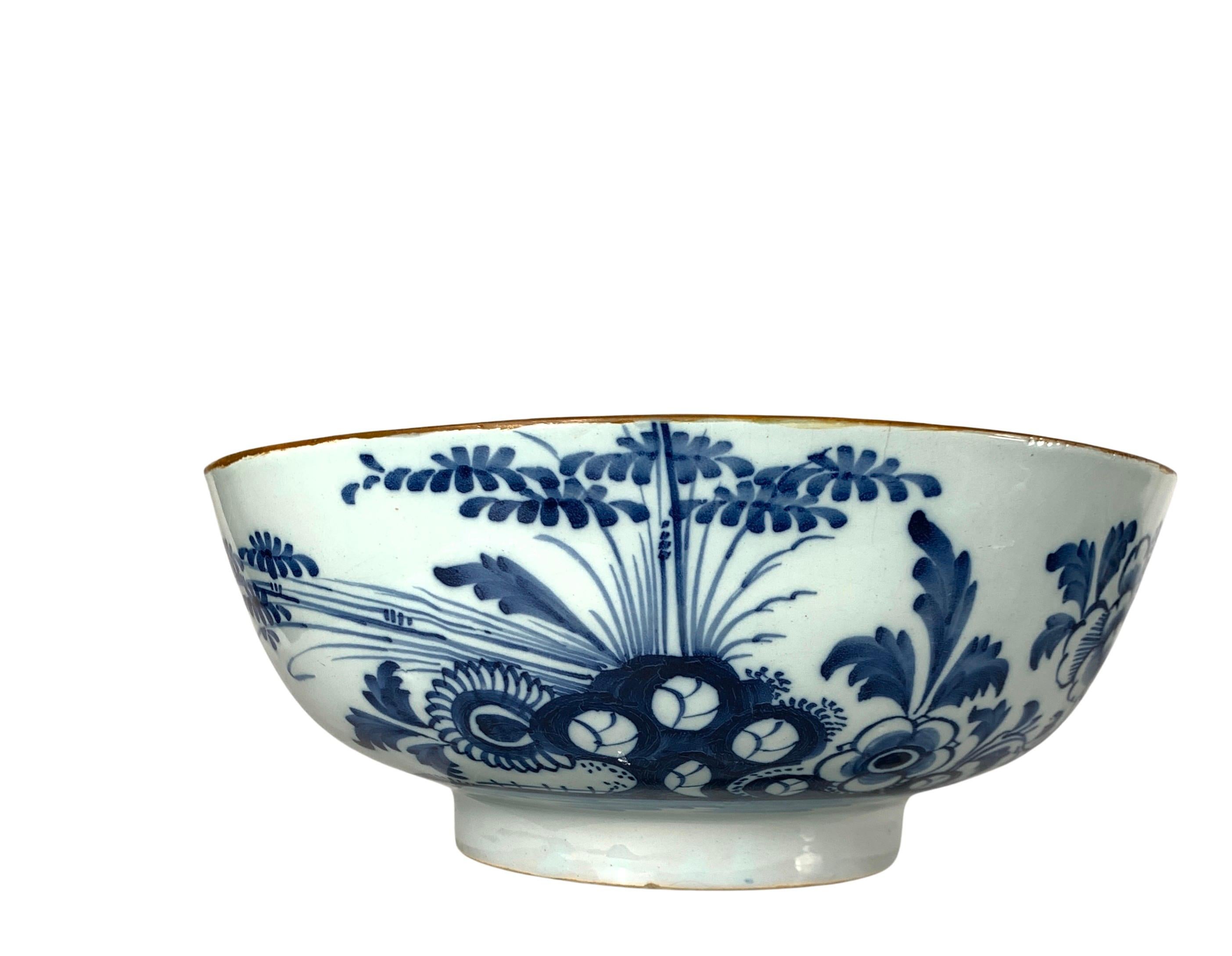 This is a blue and white Dutch Delft punch bowl (10.25
