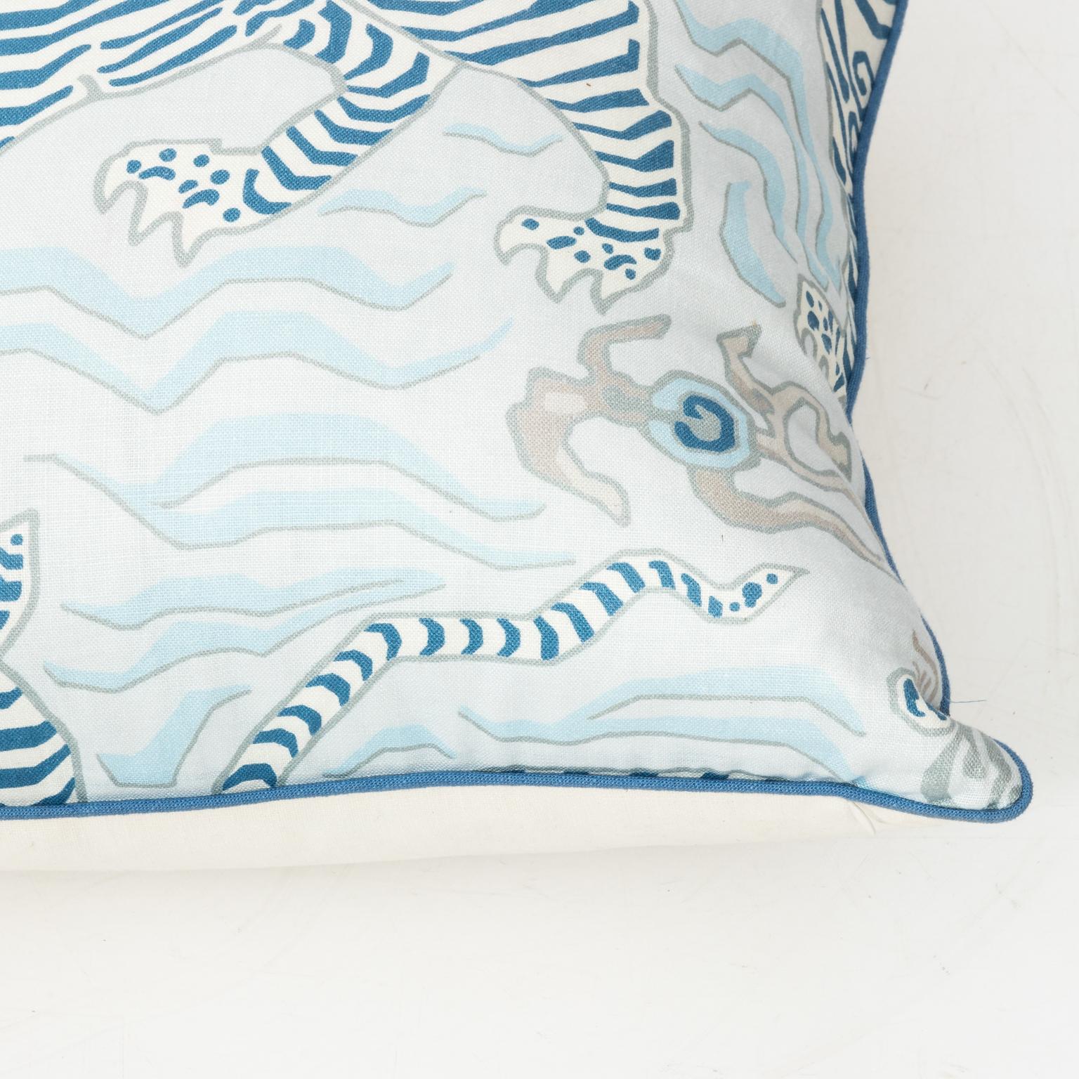 Blue and white linen pillow with stripped tiger motif stuffed with down and feathers.
 