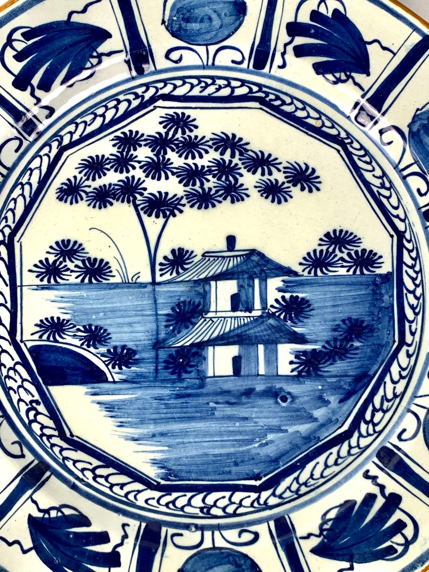 Hand-Painted Blue and White Dutch Delft Hand Painted Charger and Four Plates Made 1780-1800 For Sale