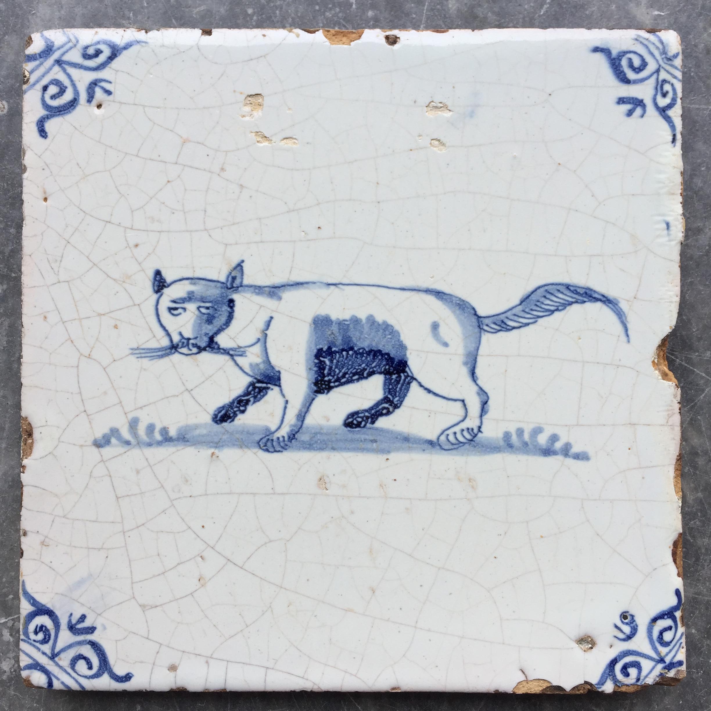 The Netherlands
Circa 1630 - 1660

A rare blue and white tile with the decoration of a nice large cat with big whiskers!

Cats are quite rarely depicted on tiles, why is unknown.

With small oxheads as corner decoration.

A genuine collectible of