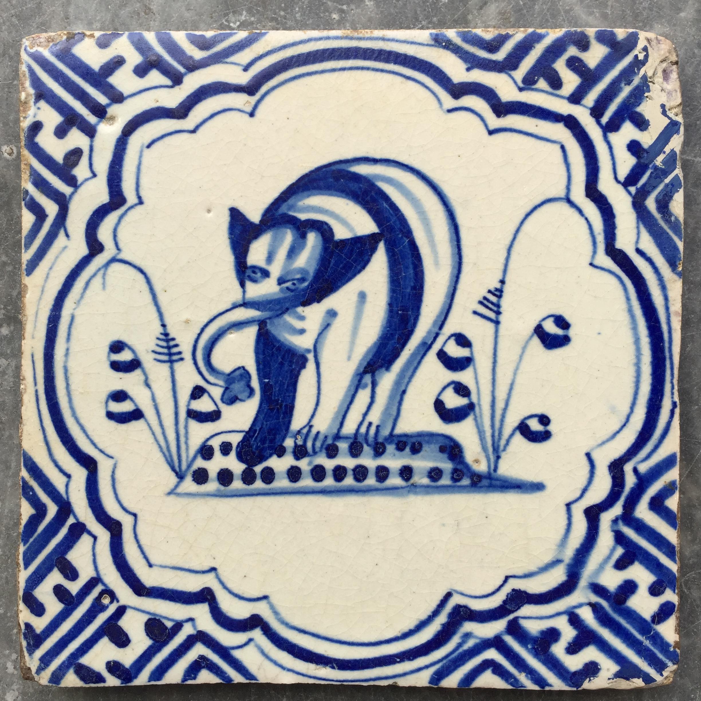 The Netherlands
Rotterdam
Circa 1620 - 1640

A full painted tile with a decoration of an elephant between two plants. A realistic elephant walking toward us.
All of this is painted within a Wanli style border.

A genuine collectible of