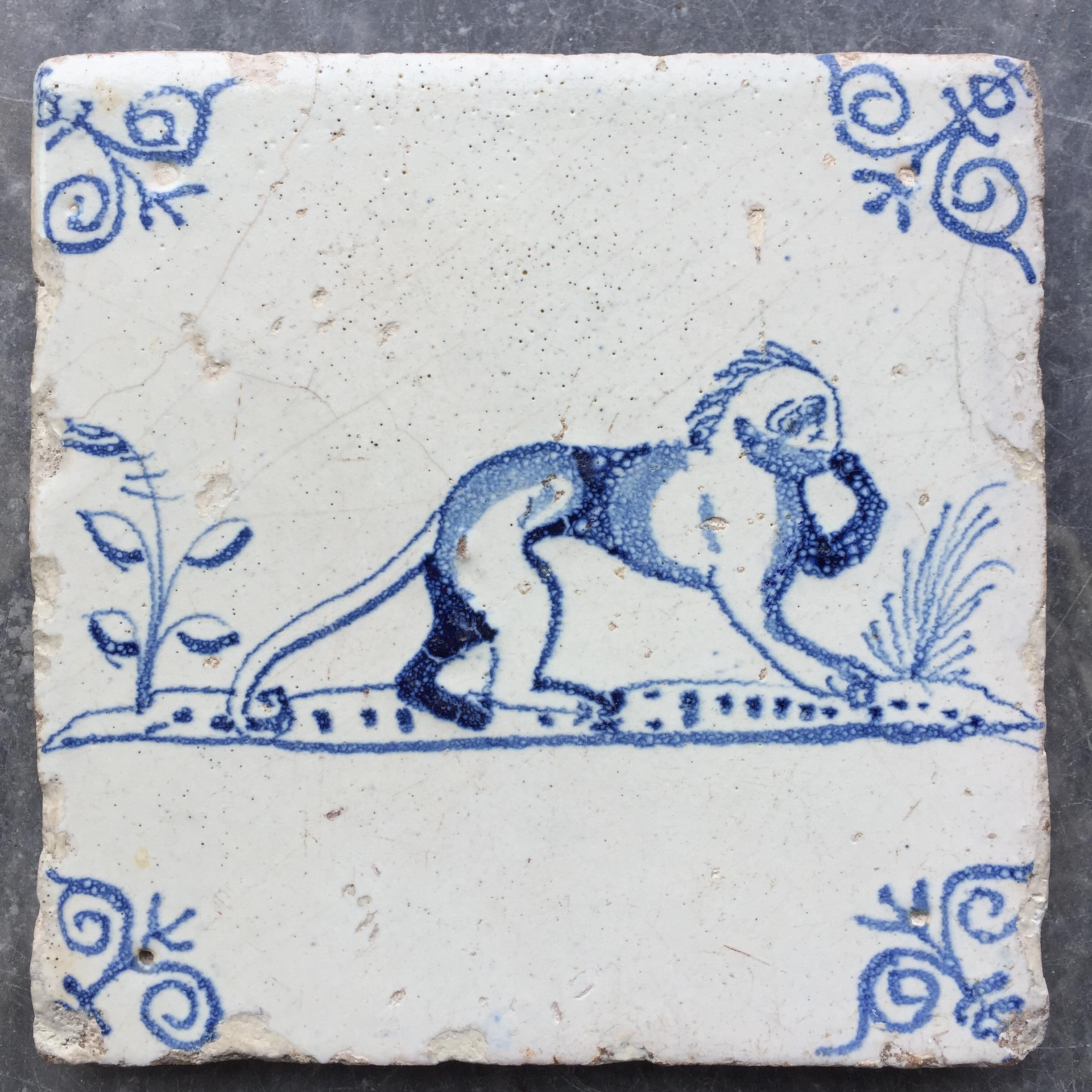 The Netherlands
Rotterdam or Gorinchem
Circa 1630 - 1650

A nice thick tile with a decoration of a monkey, unusual decoration!
With oxheads as corner decoration.

A genuine collectible of approximately 400 years old.