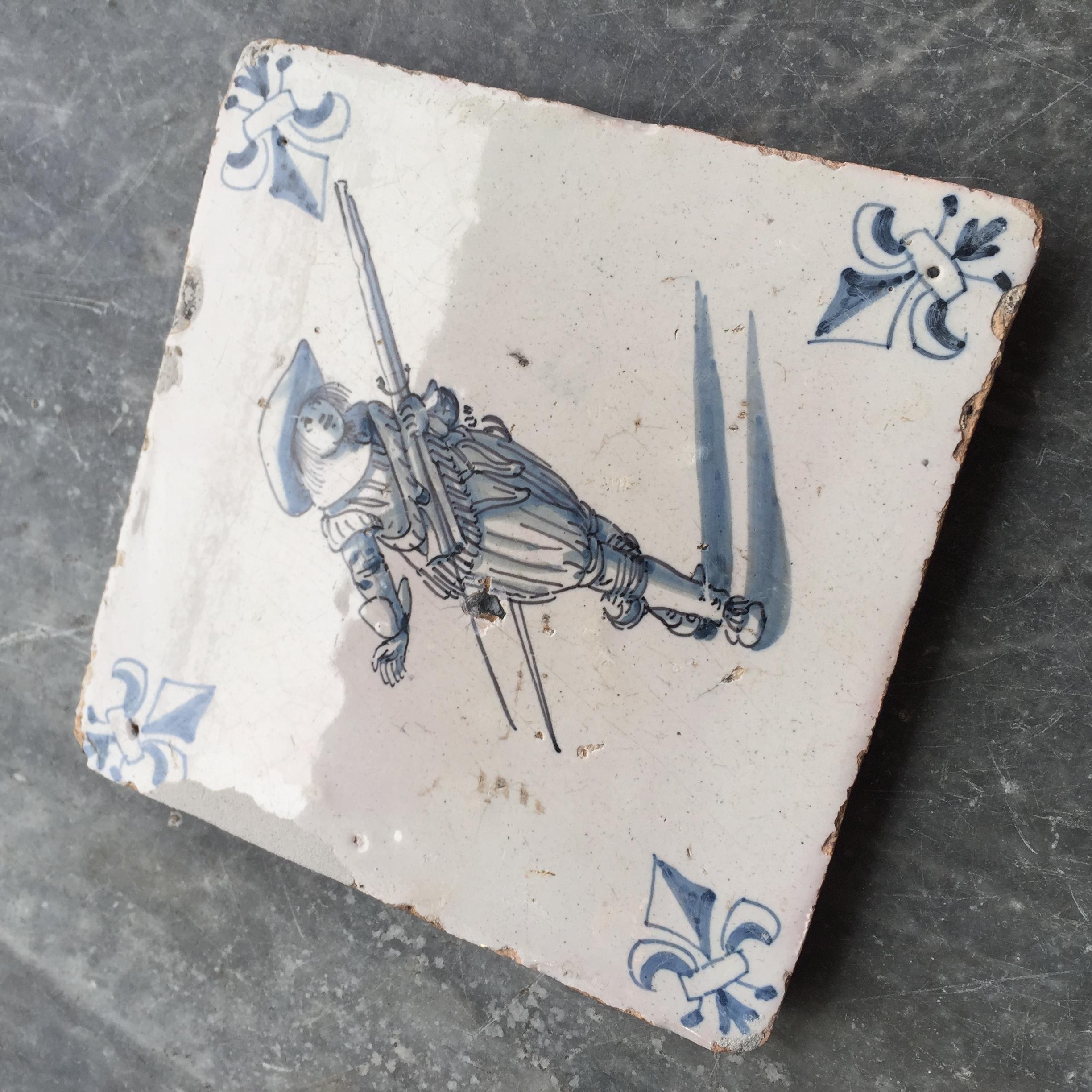 Fired Blue and White Dutch Delft Tile with Musketeer, Mid 17th Century For Sale