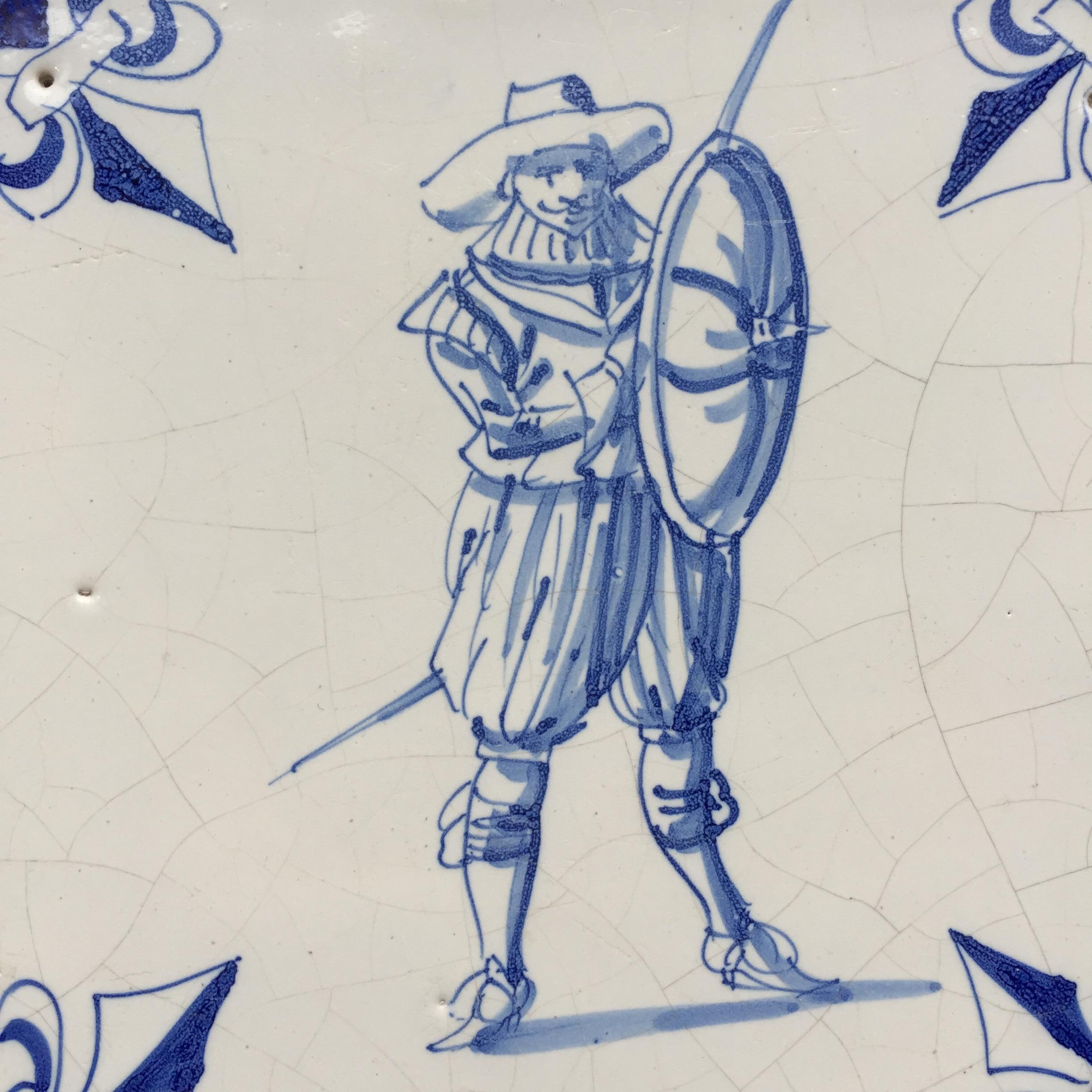 The Netherlands
Amsterdam
Circa 1625 – 1650

A blue and white Dutch tile with a decoration of a Dutch soldier from the period of the 80 Years War.
The decoration of this tile is very detailed and we can beautifully see the details in his clothing,