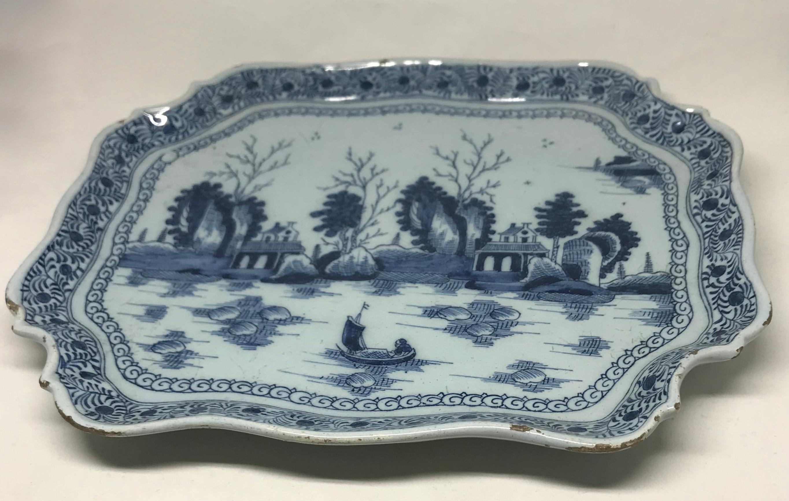 Blue and white Dutch chinoiserie platter. Antique Dutch platter in chinoiserie style with silver salver shaped border. Underglaze markings in blue 