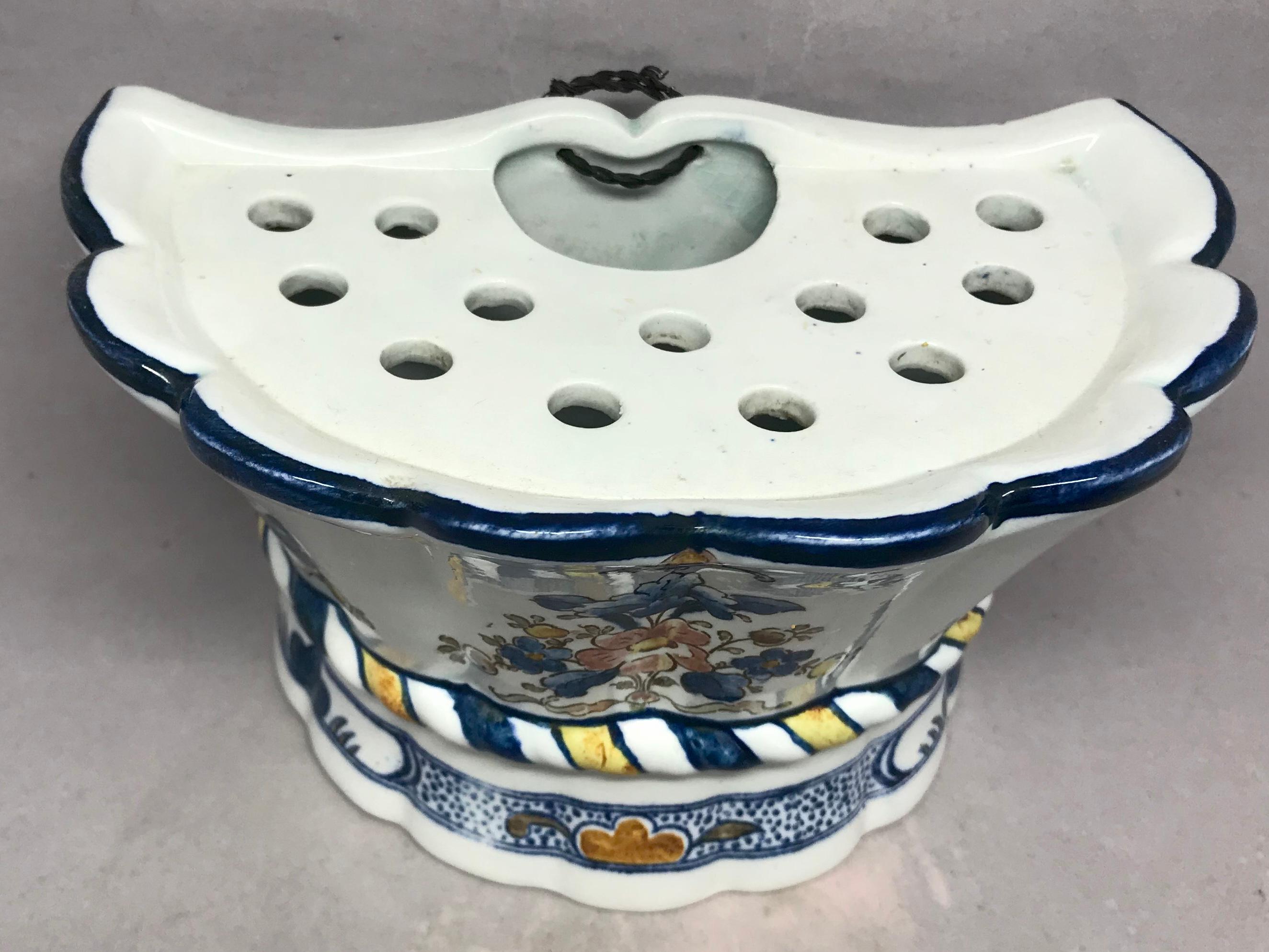 Blue and white floral bough pot. Antique Belgian/German hard paste tulipiere of scalloped bowed form with blue and white banding with floral sprays with pale rose and yellow. Blue underglaze marks for V & B Delft produced at the Mettlach factory,