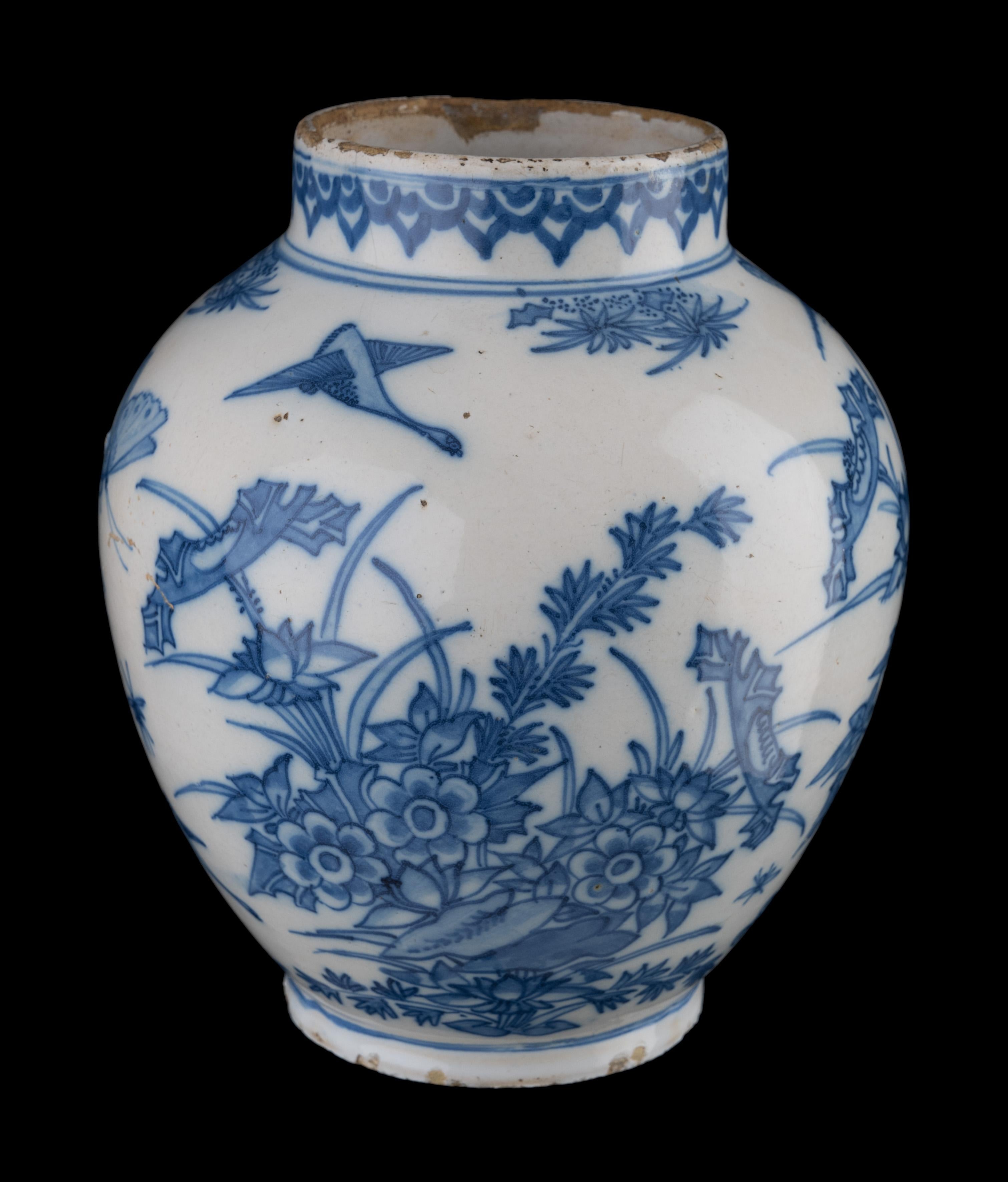 Blue and white floral chinoiserie jar. Delft, 1650-1680

The ovoid jar has a lightly spreading foot and a short, straight upright neck. The jar is painted in blue with a continuous floral decor of plants and flowers. Birds, butterflies, dragonflies