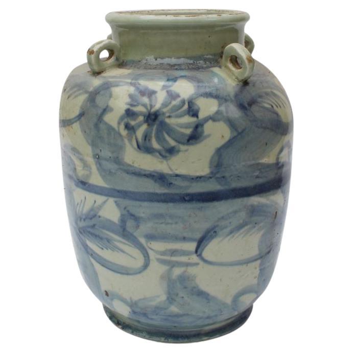 Blue and White Four Loop Handle Jar Twisted Flower Motif For Sale