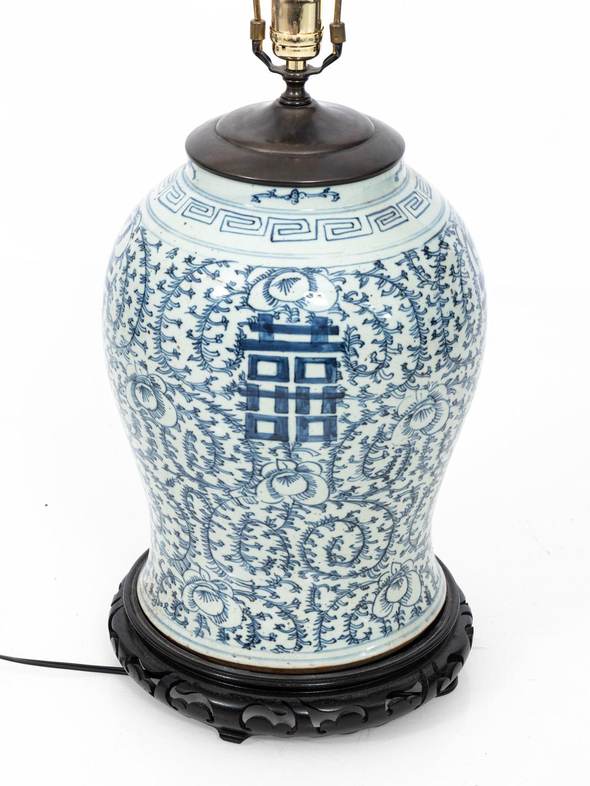 Blue and white painted Asian Style Ginger jar table lamp. Please note of wear consistent with along with minor pitting. Shade not included.