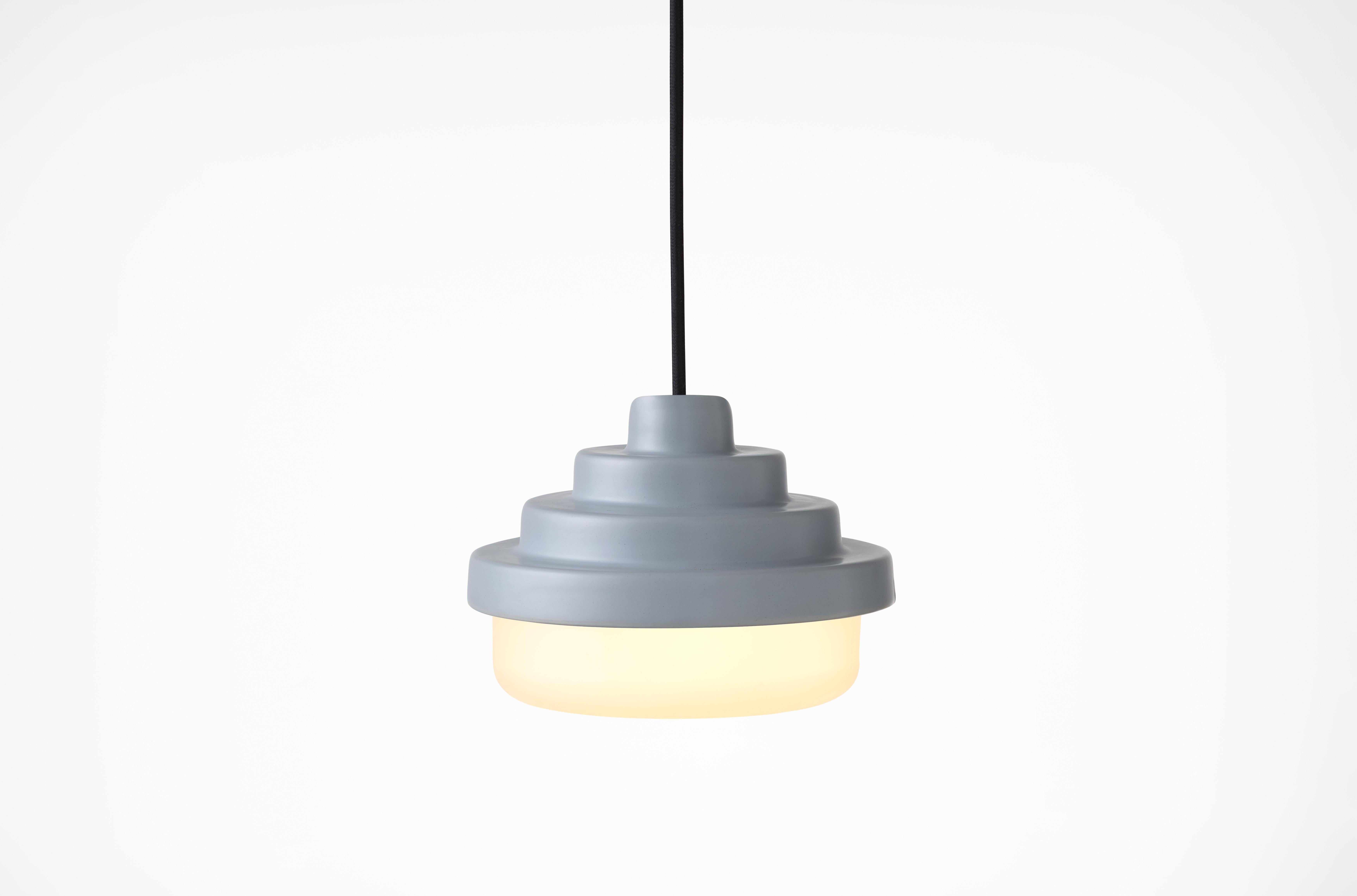 Blue and White Honey Pendant Light by Coco Flip
Dimensions: D 18 x W 18 x H 13 cm
Materials: Slip cast ceramic stoneware with blown glass. 
Weight: Approx. 2kg
Glass finishes: White
Ceramic finishes: Blue satin glaze. 

Standard fixtures included
1