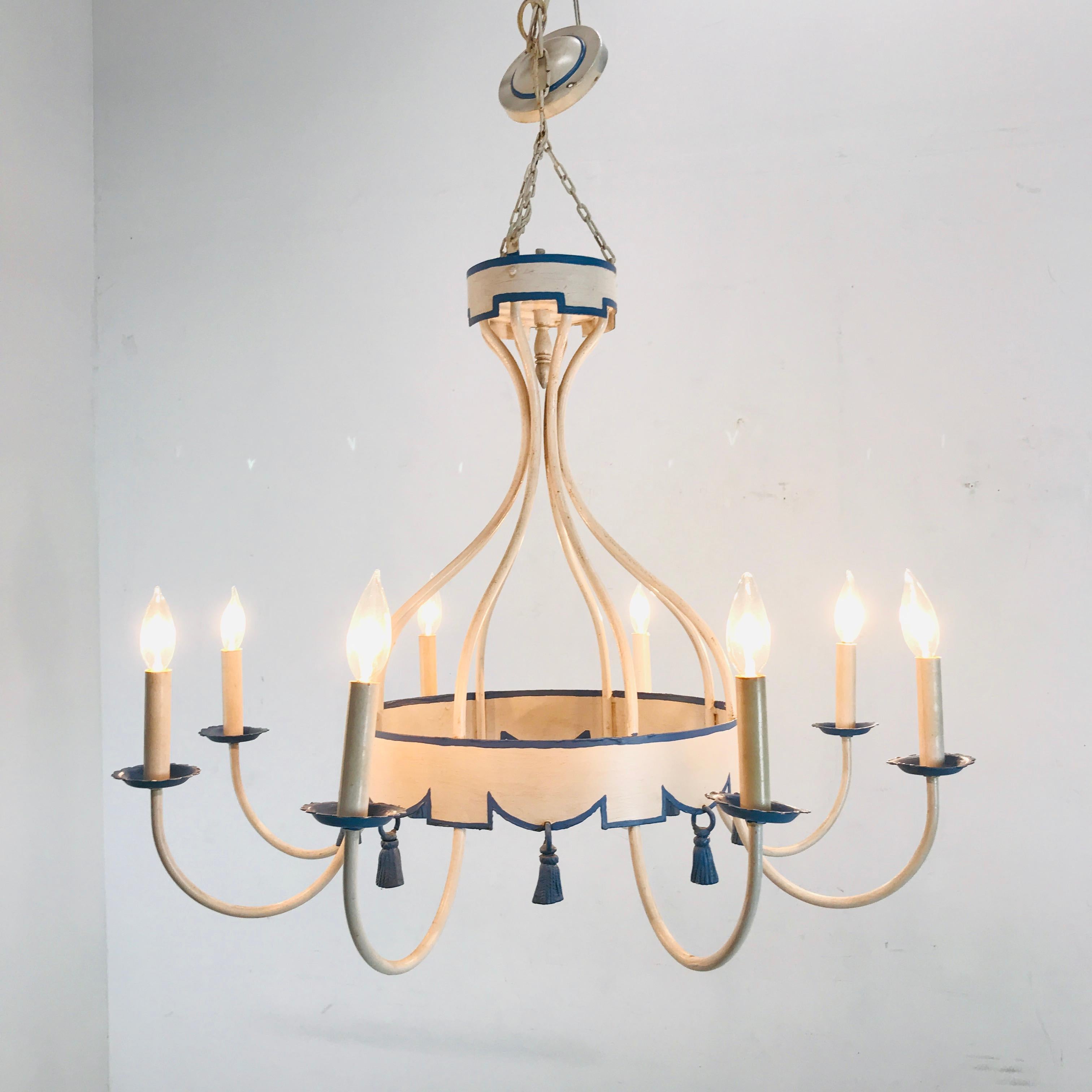 This whimsical eight light blue and white Tole tassel chandelier adds a bright and fresh look to any room. Measurement includes chain and wiring.