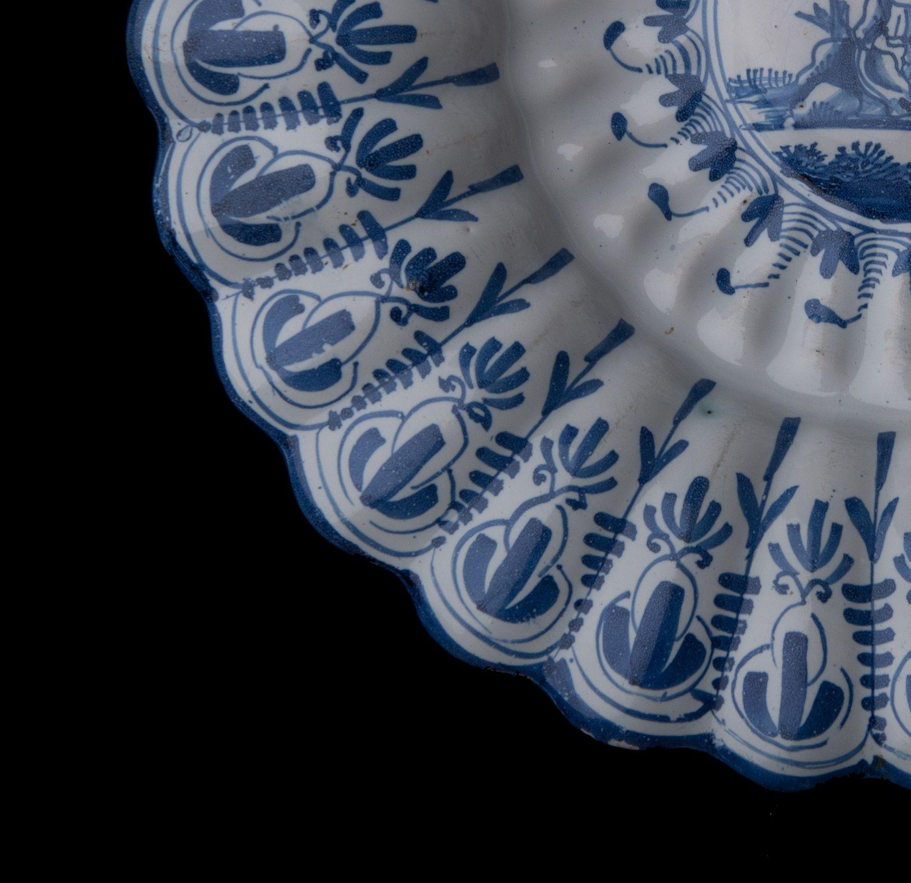 17th Century Blue and White Lobed Dish with Shepherd, Northern Netherlands, 1650-1680 For Sale