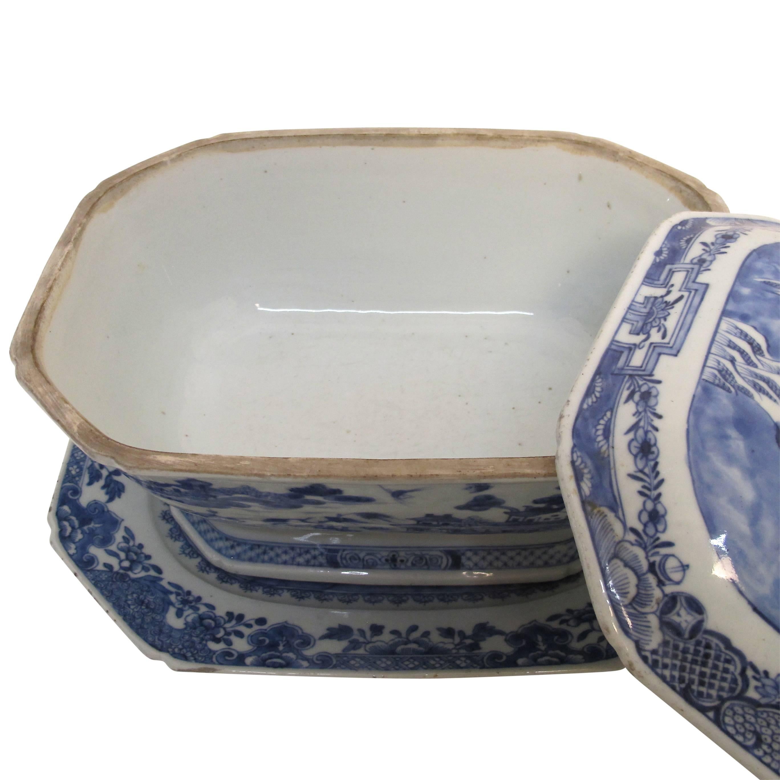 Blue and white Nanking ware lidded tureen with under plate. Chinese export, early 19th century.
Additional measurements for platter are 13 inches wide x 10.25 deep x 1.25 high.
There is a small chip on the rim of the tureen, platter has several