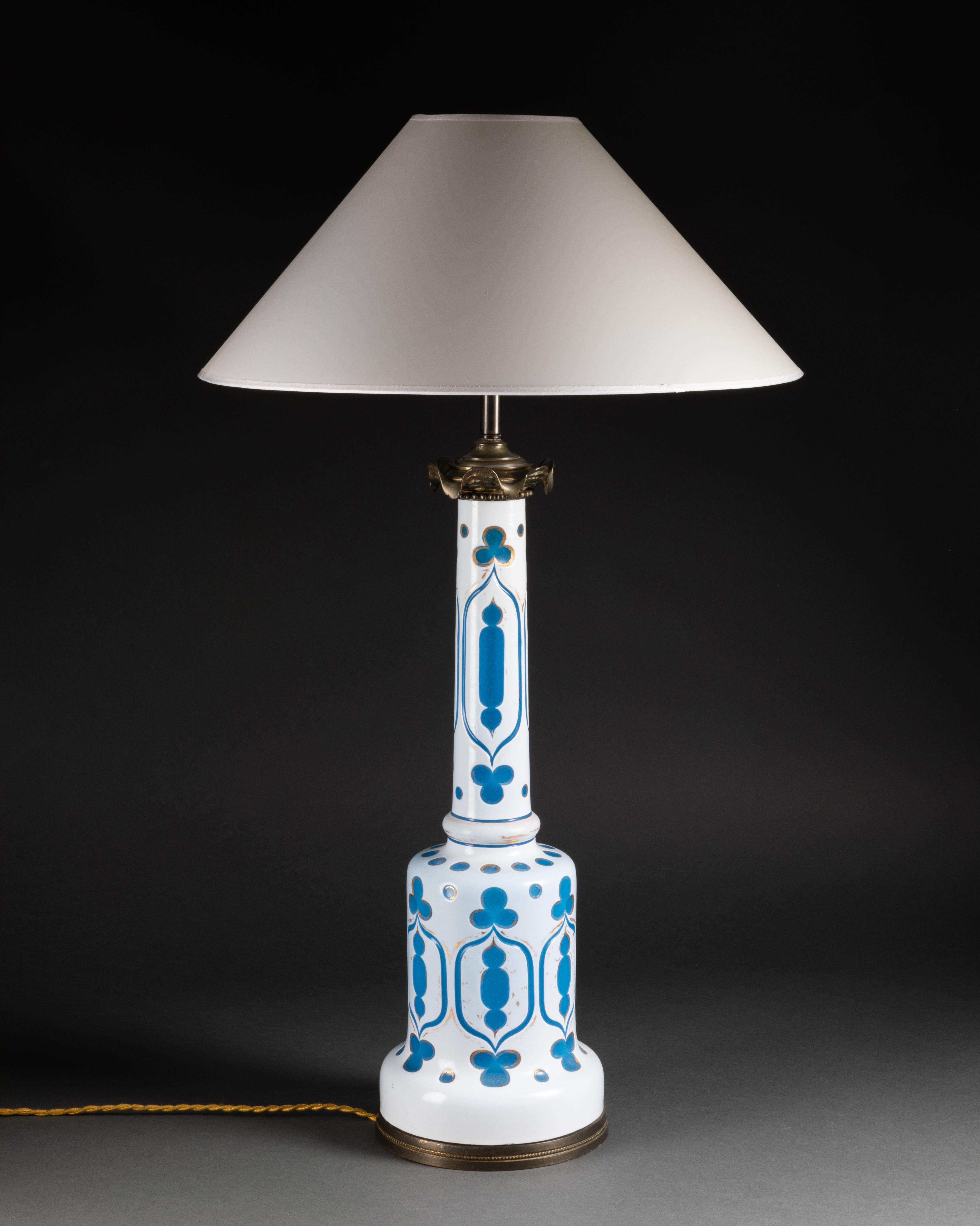 Blue and white overlay glass lamp from the iconic store of Madeleine Castaing. France, circa 1880. Purchased from Madeleine Castaing store in Paris in the 50’s. Wired to the EU standard. Sold with or without lampshade. Height to socket 64 cm.