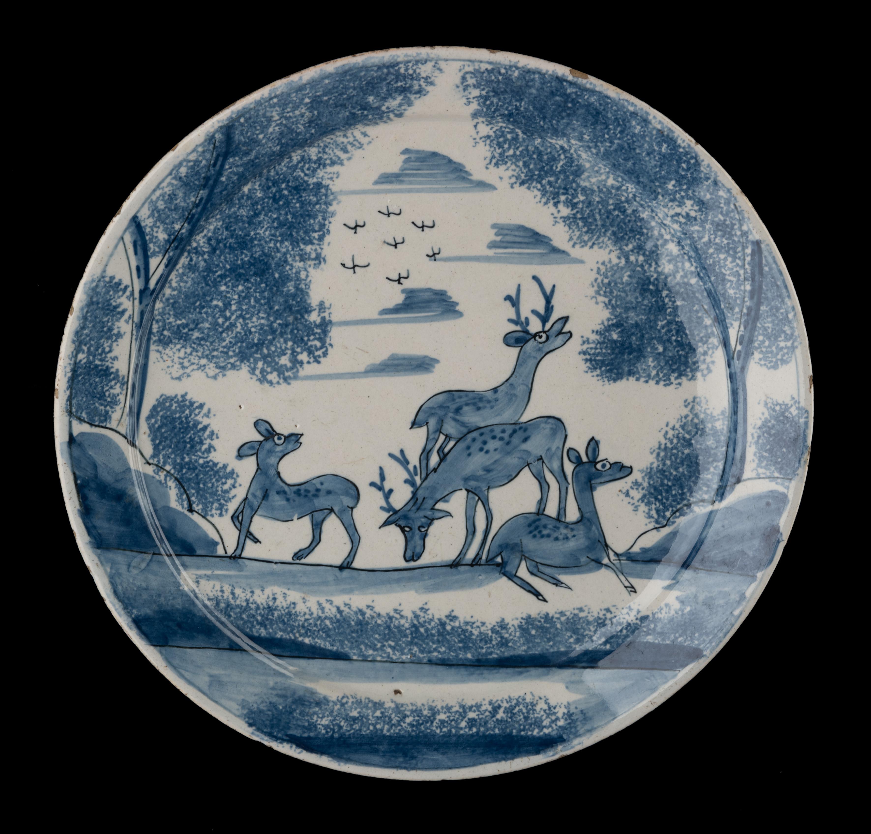 Blue and white plate with deer in a landscape  Delft, circa 1700

The plate has a narrow, flat flange and is painted in blue with a landscape with four deer between trees. Birds fly in the sky. The foliage of the trees is sponged.

Dimensions: