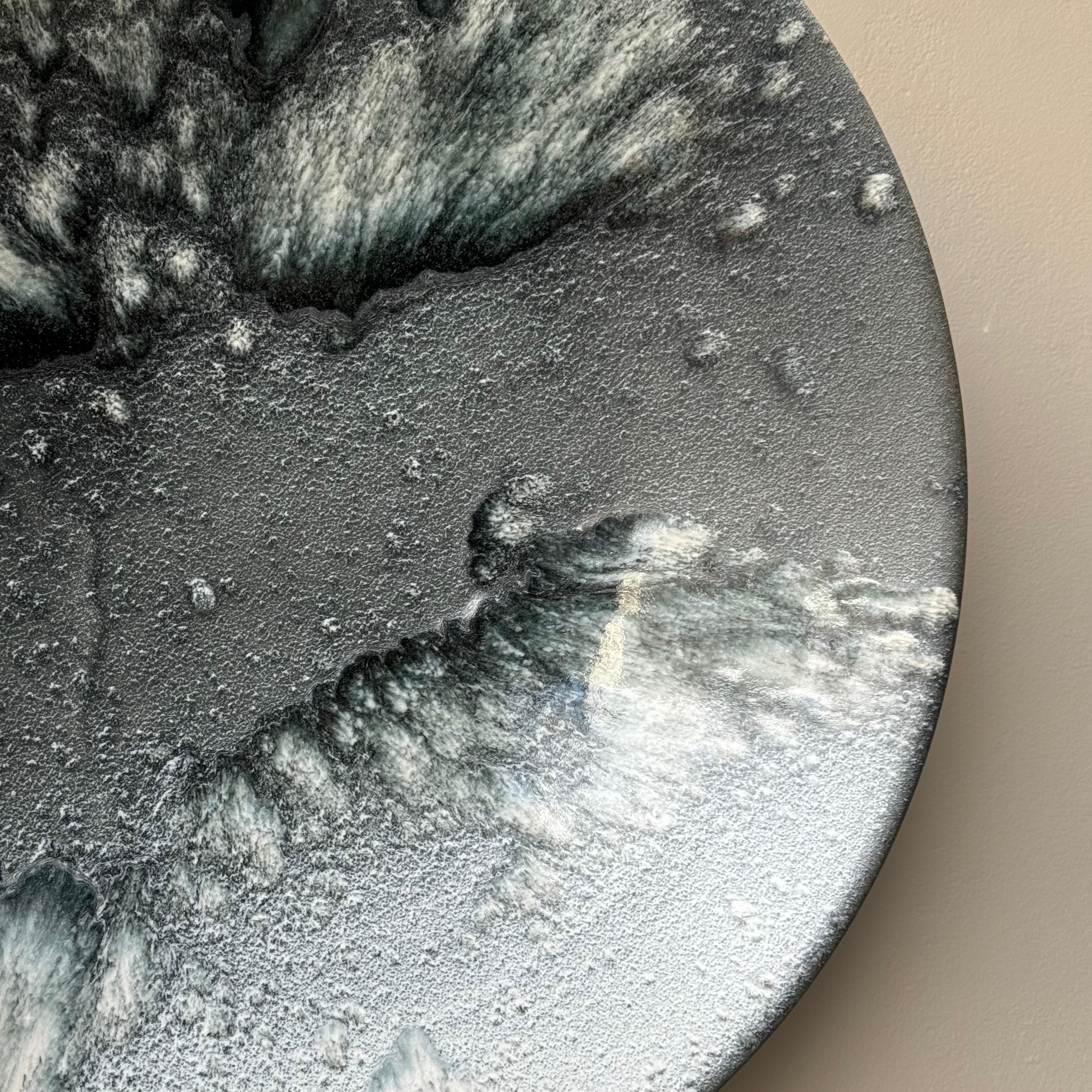 A blue and white stoneware platter made and designed in Denmark by K H Würtz. 

The interaction between the matte and shiny areas of this lightly concave platter give the surface pattern incredible depth. The shiner, white areas are surrounded by an