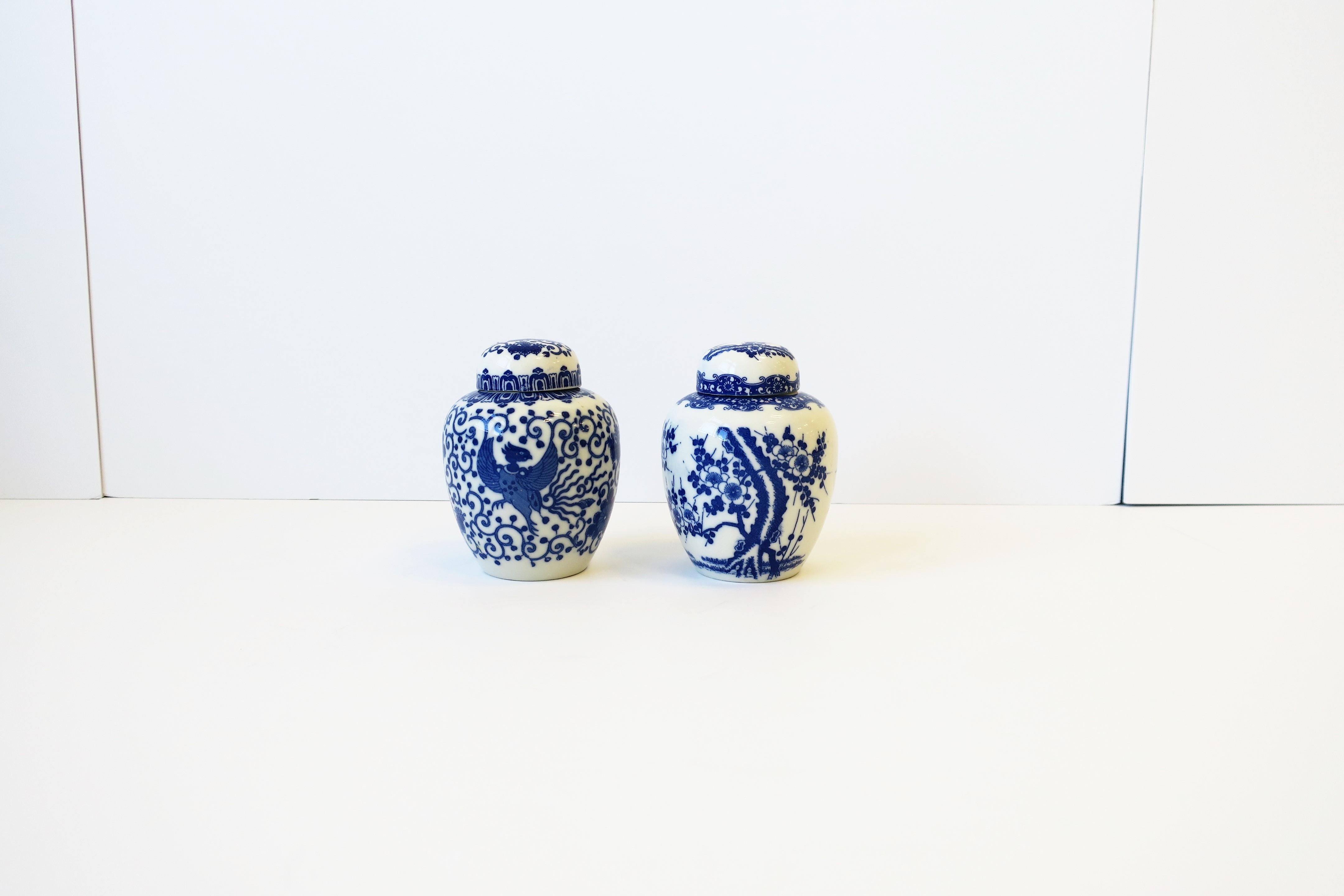 A pair/set of blue and white porcelain Japanese ginger jars with phoenix bird and cherry blossom flower design, circa mid-20th century, 1960s, Japan. Marked on bottom as show in image #19. Dimensions: 3.88