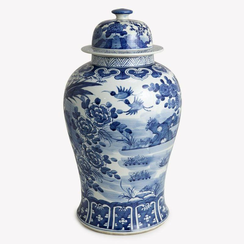 Blue And white porcelain temple jar blossom garden with birds

The special antique process makes it looks like a piece of art from a museum. 
High fire porcelain, 100% hand shaped, hand painted. Distress, chips and other imperfections create