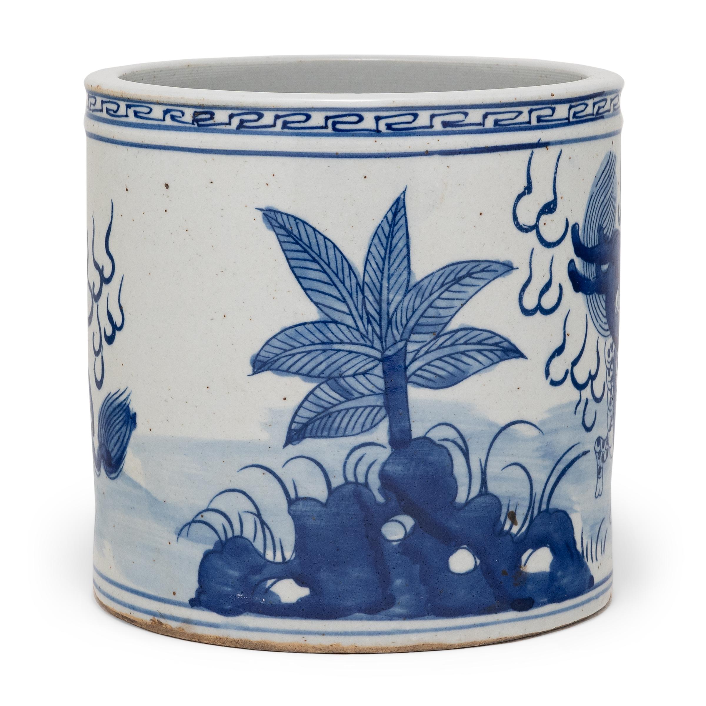 Set alongside the four treasures of the study - the calligraphy brush, ink, paper, and inkstone - a brush pot, or bitong, was an essential fixture of the scholars' desk. This porcelain brush pot beautifully exemplifies this traditional form with the