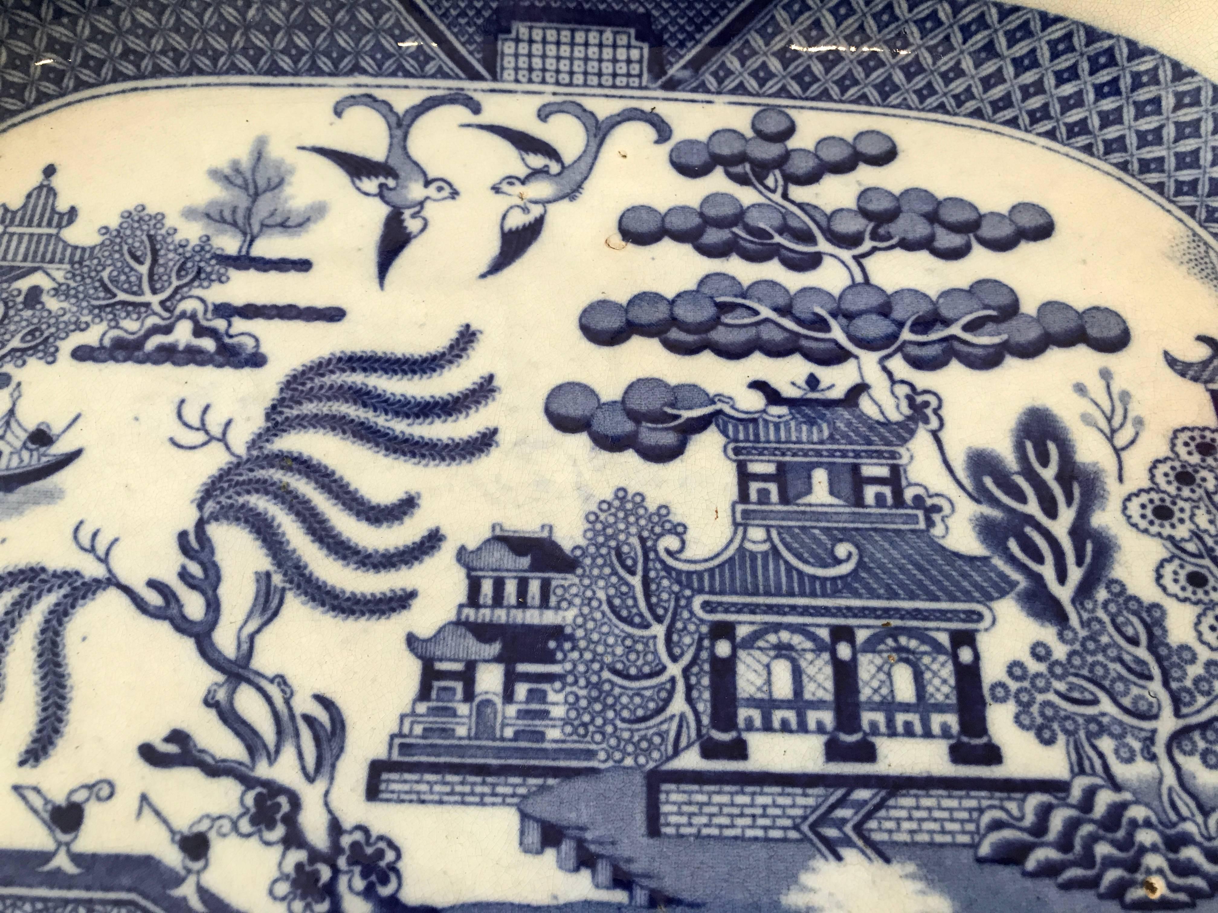 Add this to your blue and white collection of 19th century transferware. There are apparently no repairs or restoration, and the back of the platter confirms it’s age with signs of wear. The platter has been well enjoyed and can be used on a table