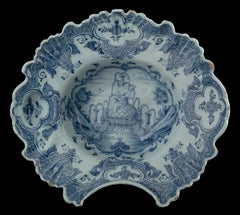 Blue and white shaving bowl with flute-playing putto Delft, 1759-1771