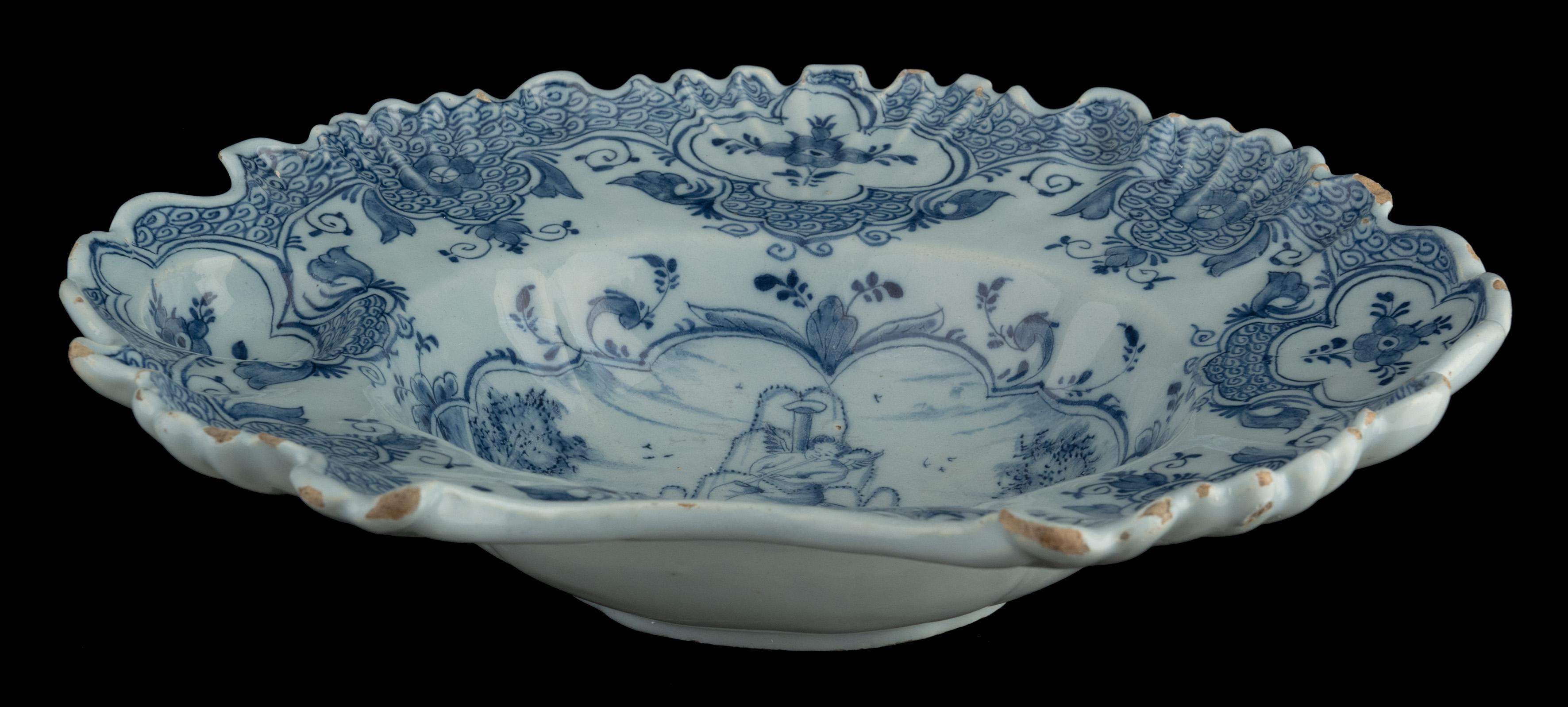 18th Century Blue and white shaving bowl with flute-playing putto Delft, 1759-1771 For Sale