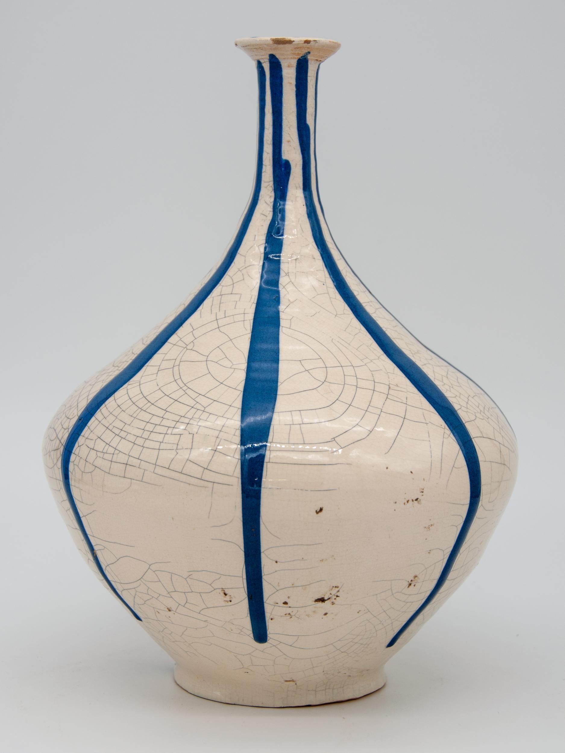 Blue and white stripe pottery vase with crazed finish.