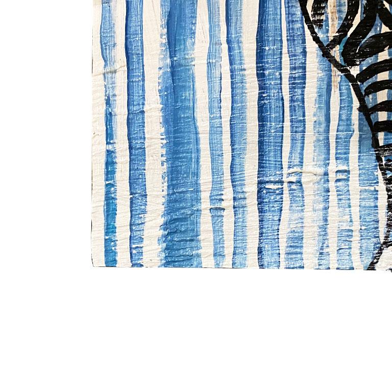 A gorgeous painting of a zebra in blue and black. This piece features the outline of a zebra in black, painted on a blue and white striped background. This piece is painted on wood and is ready to hang with a hanging wire on the back. 

How We